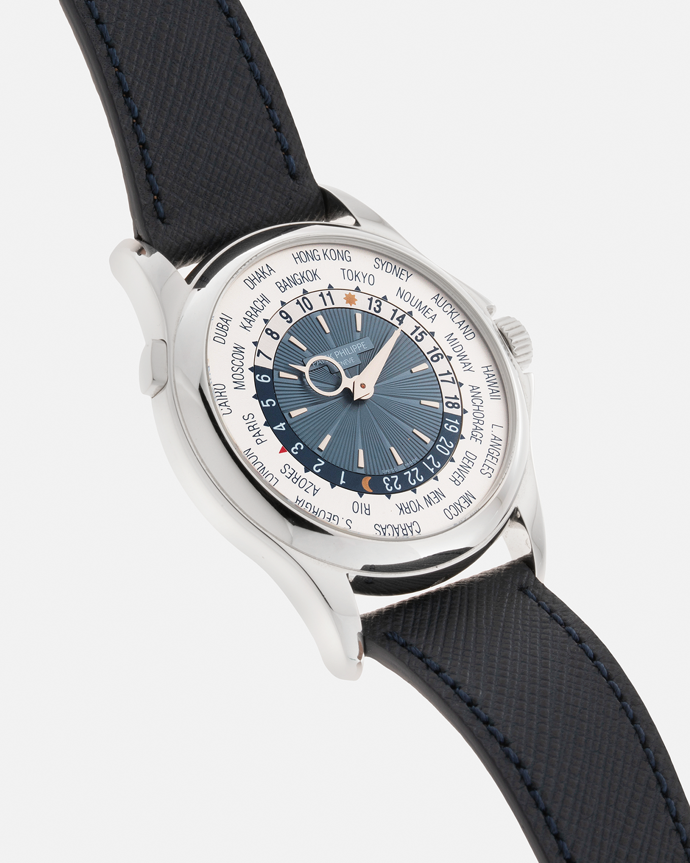 Brand: Patek Philippe Year: 2010s Model: World Time Reference Number: 5130P Material: Platinum 950 Movement: Patek Philippe Cal. 240 HU Micro-Rotor, Self-Winding Case Diameter: 39.5mm Lug Width: 21mm Bracelet: Molequin Oxford Blue Textured Calf Leather Strap with Signed Platinum 950 Deployant Clasp