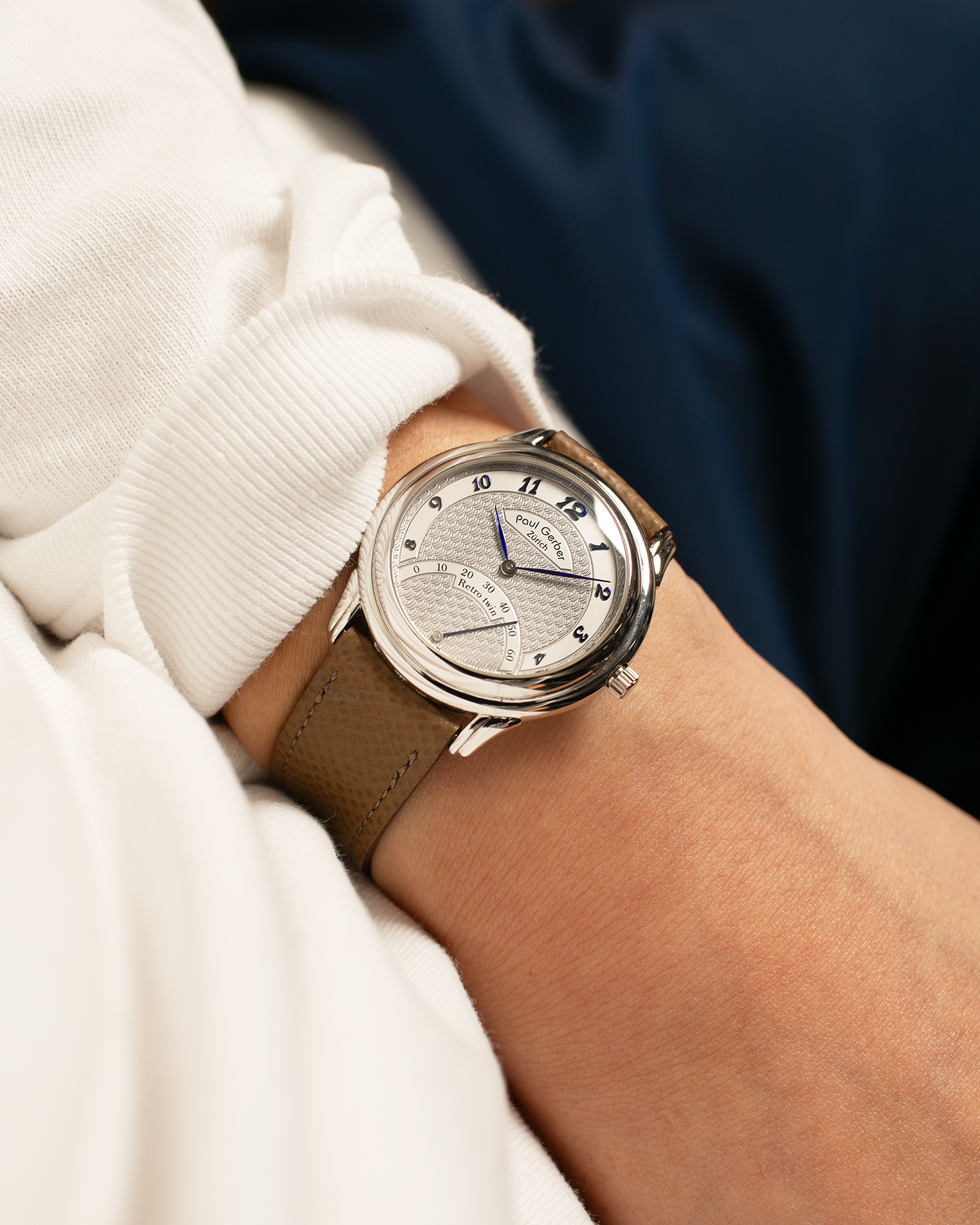 Brand: Paul Gerber
Year: 2000’s
Model: Retro Twin
Reference: 157
Material: 18-carat White Gold
Movement: Self-Winding Paul Gerber Cal. 15 (Heavily-Modified Peseux Cal. 7001)
Case Dimensions: 36mm Diameter 11mm Thickness
Lug Width: 18mm
Strap: Paul Gerber Dark Brown Calf Leather Strap with Signed 18-carat Yellow Gold Tang Buckle