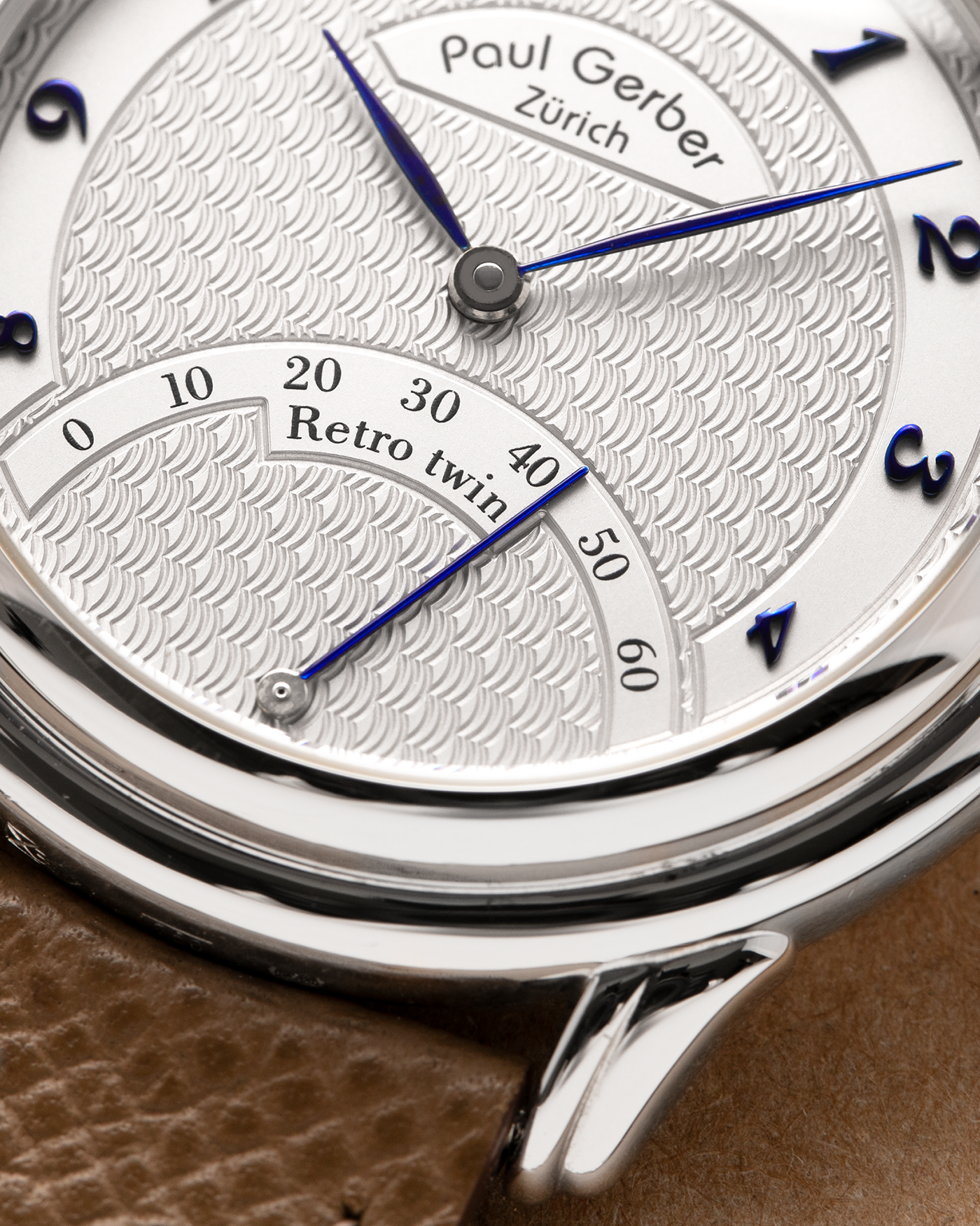 Brand: Paul Gerber
Year: 2000’s
Model: Retro Twin
Reference: 157
Material: 18-carat White Gold
Movement: Self-Winding Paul Gerber Cal. 15 (Heavily-Modified Peseux Cal. 7001)
Case Dimensions: 36mm Diameter 11mm Thickness
Lug Width: 18mm
Strap: Paul Gerber Dark Brown Calf Leather Strap with Signed 18-carat Yellow Gold Tang Buckle