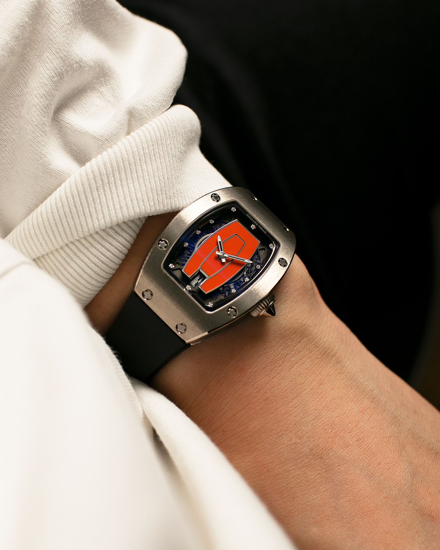 Brand: Richard Mille Year: 2000s Model: RM007 ‘Orange Lip’ Case Material: 18-carat White Gold Case, Diamond-Set Hour Markers Movement: Richard Mille Cal. RM007, Self-Winding Case Dimensions: 31mm x 45mm  Strap: Richard Mille Black Rubber Strap with Signed Titanium Deployant Clasp