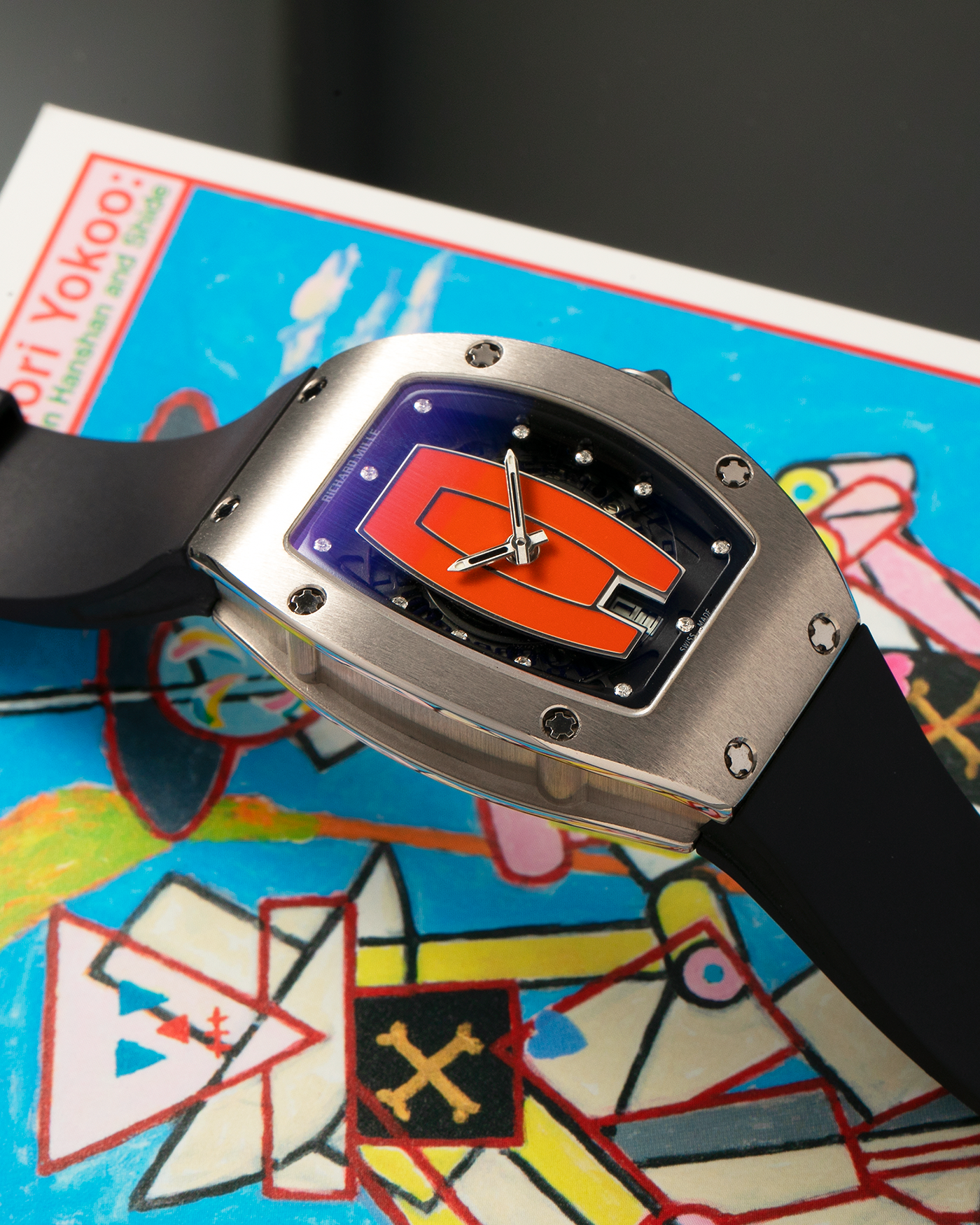 Brand: Richard Mille Year: 2000s Model: RM007 ‘Orange Lip’ Case Material: 18-carat White Gold Case, Diamond-Set Hour Markers Movement: Richard Mille Cal. RM007, Self-Winding Case Dimensions: 31mm x 45mm  Strap: Richard Mille Black Rubber Strap with Signed Titanium Deployant Clasp