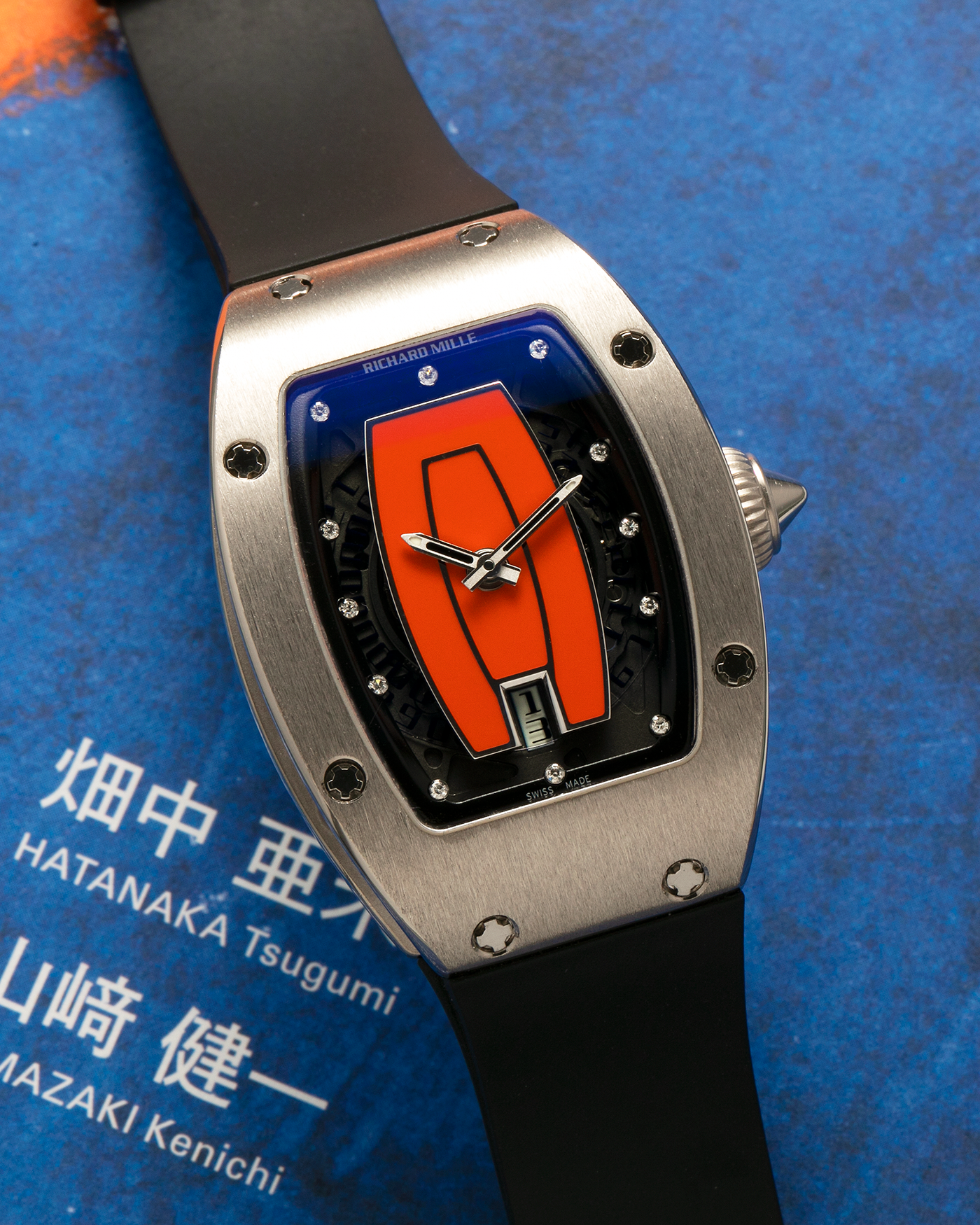 Brand: Richard Mille Year: 2000s Model: RM007 ‘Orange Lip’ Case Material: 18-carat White Gold Case, Diamond-Set Hour Markers Movement: Richard Mille Cal. RM007, Self-Winding Case Dimensions: 31mm x 45mm  Strap: Richard Mille Black Rubber Strap with Signed Titanium Deployant Clasp