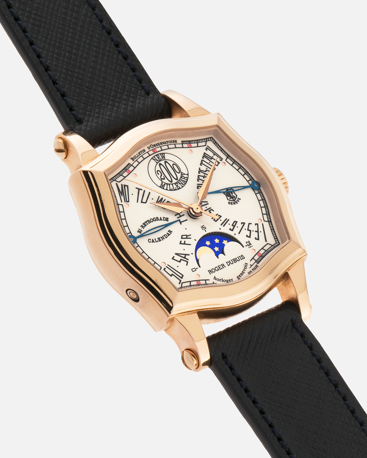 Brand: Roger Dubuis
Year: 2000
Model: Sympathie 37 2000 New Millenary
Material: 18k Rose Gold
Movement: Roger Dubuis Cal. 5740
Case Dimensions: 34mm Diameter 11mm Thickness
Lug Width: 18mm
Strap: Molequin Navy Blue Textured Calf Leather Strap with Signed 18k Rose Gold Tang Buckle