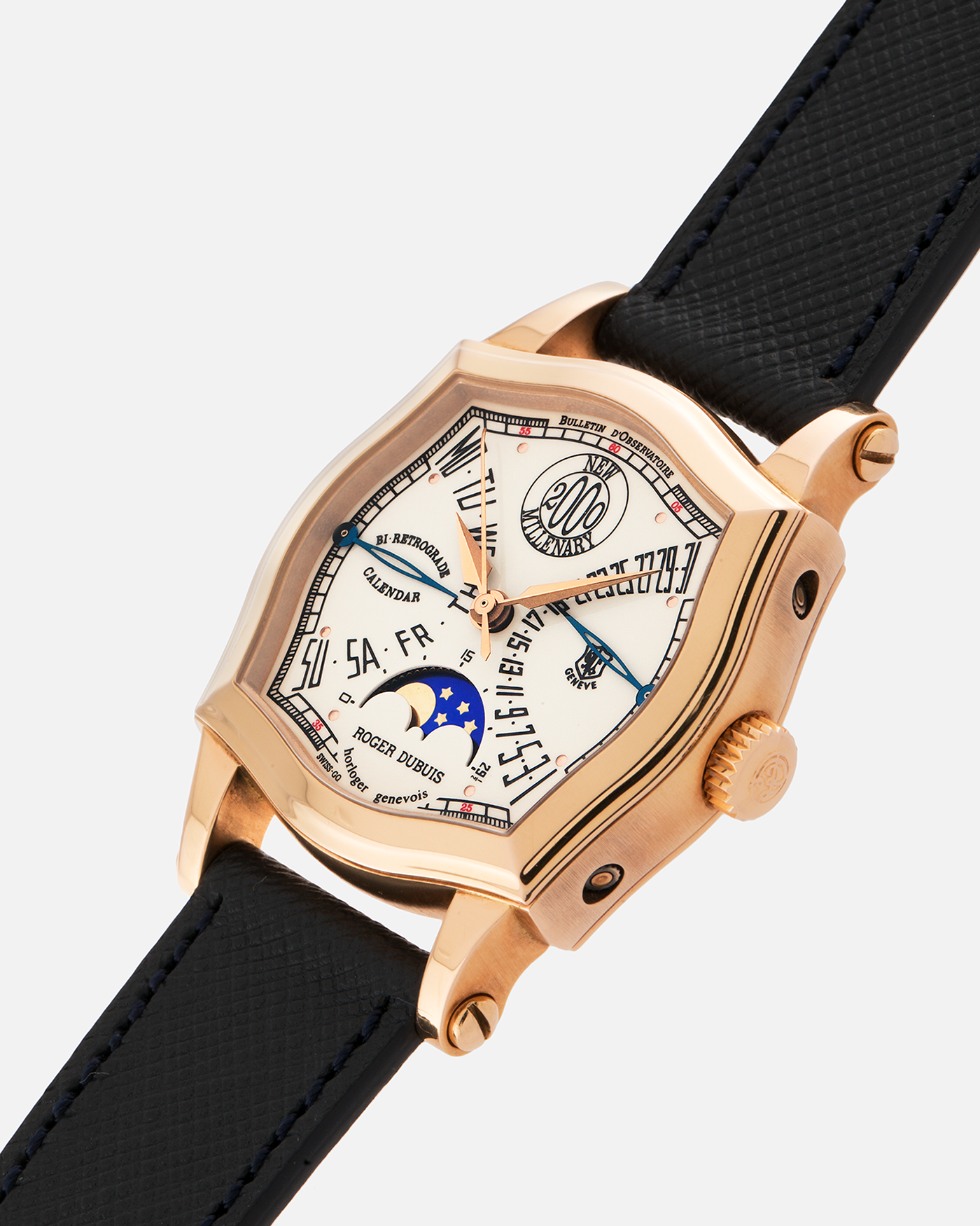 Brand: Roger Dubuis
Year: 2000
Model: Sympathie 37 2000 New Millenary
Material: 18k Rose Gold
Movement: Roger Dubuis Cal. 5740
Case Dimensions: 34mm Diameter 11mm Thickness
Lug Width: 18mm
Strap: Molequin Navy Blue Textured Calf Leather Strap with Signed 18k Rose Gold Tang Buckle