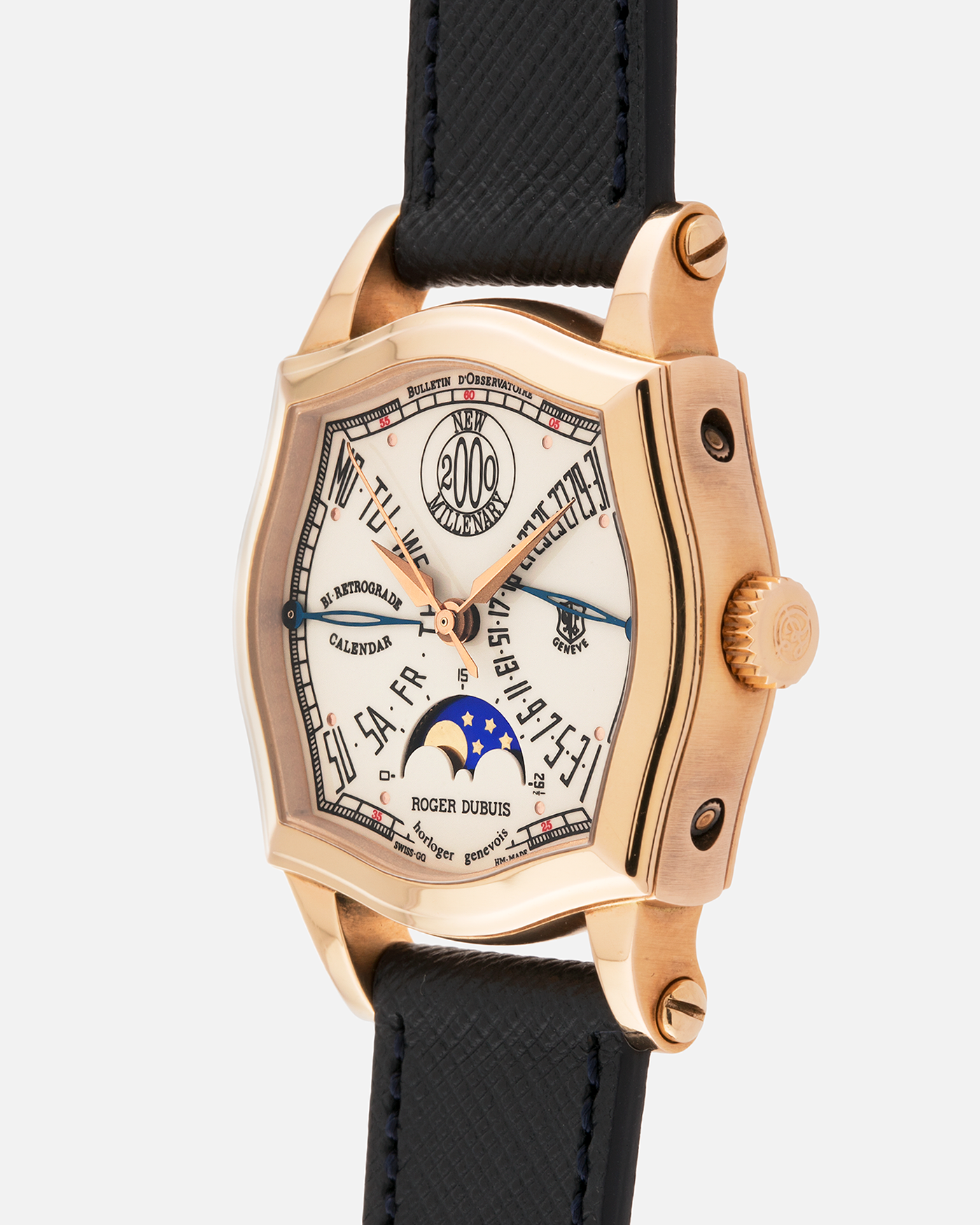 Brand: Roger Dubuis
Year: 2000
Model: Sympathie 37 2000 New Millenary
Material: 18k Rose Gold
Movement: Roger Dubuis Cal. 5740
Case Dimensions: 34mm Diameter 11mm Thickness
Lug Width: 18mm
Strap: Molequin Navy Blue Textured Calf Leather Strap with Signed 18k Rose Gold Tang Buckle