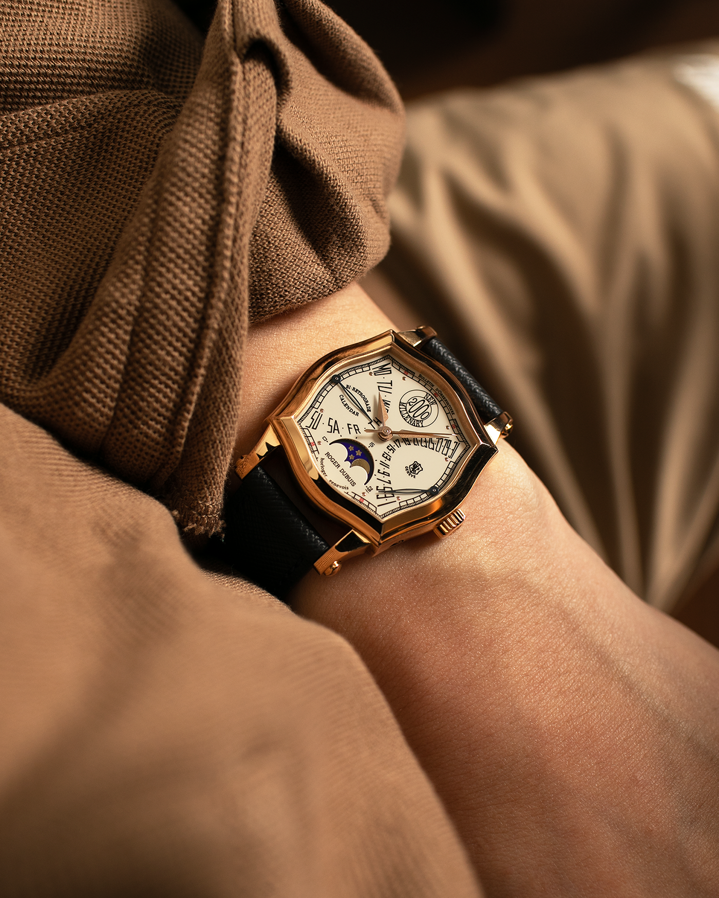 Brand: Roger Dubuis
Year: 2000
Model: Sympathie 37 2000 New Millenary
Material: 18k Rose Gold
Movement: Roger Dubuis Cal. 5740
Case Dimensions: 34mm Diameter 11mm Thickness
Lug Width: 18mm
Strap: Molequin Navy Blue Textured Calf Leather Strap with Signed 18k Rose Gold Tang Buckle
