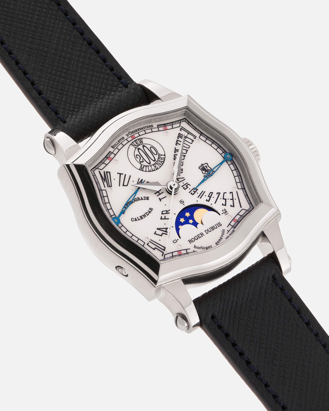 Brand: Roger Dubuis
Year: 2000
Model: Sympathie 37 Bi-retrograde Calendar 2000 New Millenary
Material: 18-carat White Gold
Movement: Roger Dubuis Cal. 5840
Case Dimensions: 34mm Diameter, 11mm Thickness
Lug Width: 18mm
Strap: Molequin Navy Blue Textured Calf Leather Strap with Signed 18-carat White Gold Tang Buckle