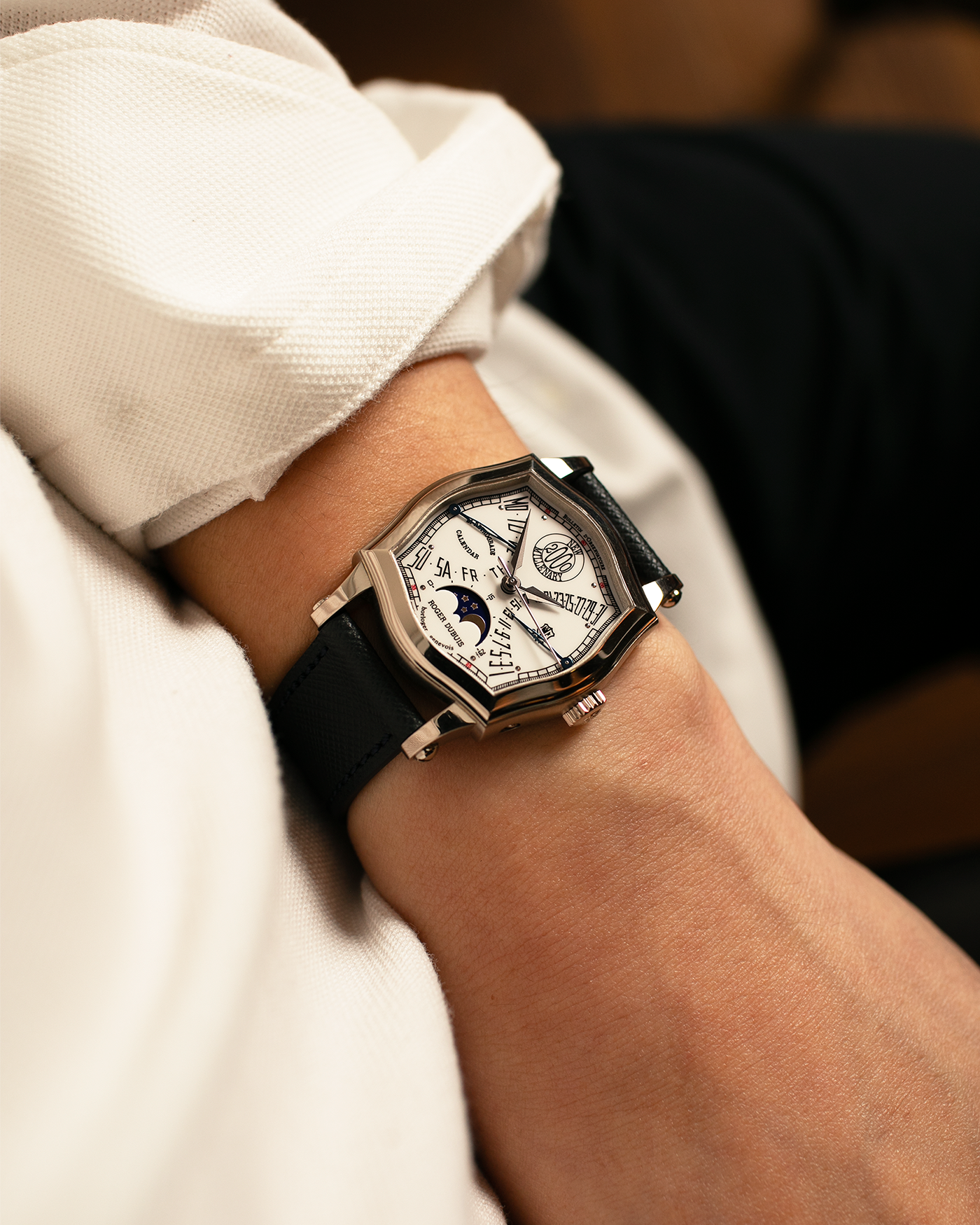 Brand: Roger Dubuis
Year: 2000
Model: Sympathie 37 Bi-retrograde Calendar 2000 New Millenary
Material: 18-carat White Gold
Movement: Roger Dubuis Cal. 5840
Case Dimensions: 34mm Diameter, 11mm Thickness
Lug Width: 18mm
Strap: Molequin Navy Blue Textured Calf Leather Strap with Signed 18-carat White Gold Tang Buckle