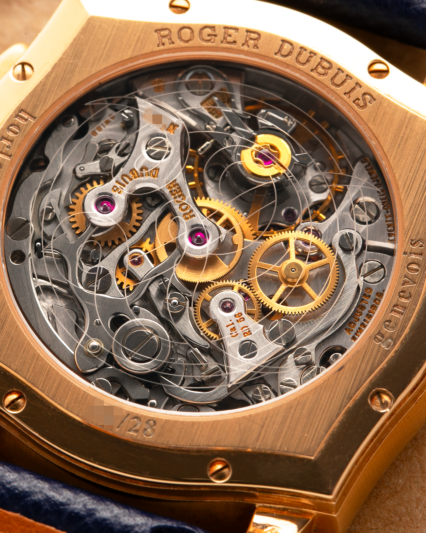 Brand: Roger Dubuis
Year: Late 1990’s/2000’s
Model: Sympathie 37 Perpetual Chronograph
Material: 18k Rose Gold
Movement: Cal RD56 / Lemania 2310
Case Diameter: 37mm
Strap: Nostime Blue Textured Calf Strap and Roger Dubuis 18k Rose Gold Tang Buckle
