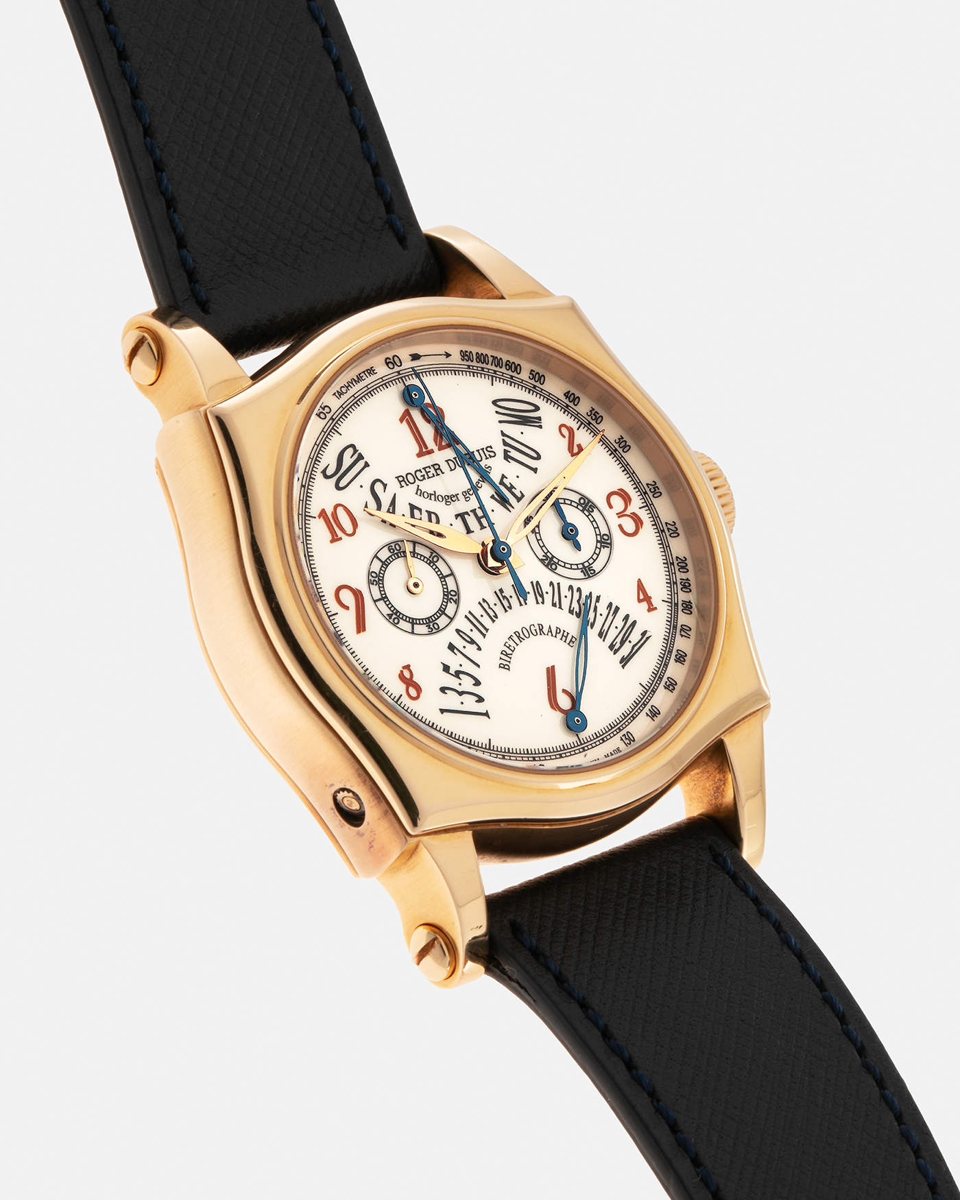 Brand: Roger Dubuis Year: 2000’s Model: Sympathie 40 Biretrograde Chronograph Material: 18-carat Yellow Gold Movement: Roger Dubuis Cal. RD 5630 (Based on the Lemania Cal. 2310), Manual-Winding Case Diameter: 40mm Strap: Molequin Navy Blue Textured Calf Leather Strap with Signed 18-carat Yellow Gold Roger Dubuis Tang Buckle