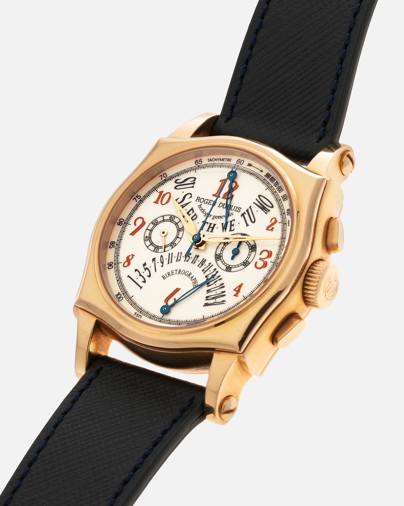 Brand: Roger Dubuis Year: 2000’s Model: Sympathie 40 Biretrograde Chronograph Material: 18-carat Yellow Gold Movement: Roger Dubuis Cal. RD 5630 (Based on the Lemania Cal. 2310), Manual-Winding Case Diameter: 40mm Strap: Molequin Navy Blue Textured Calf Leather Strap with Signed 18-carat Yellow Gold Roger Dubuis Tang Buckle
