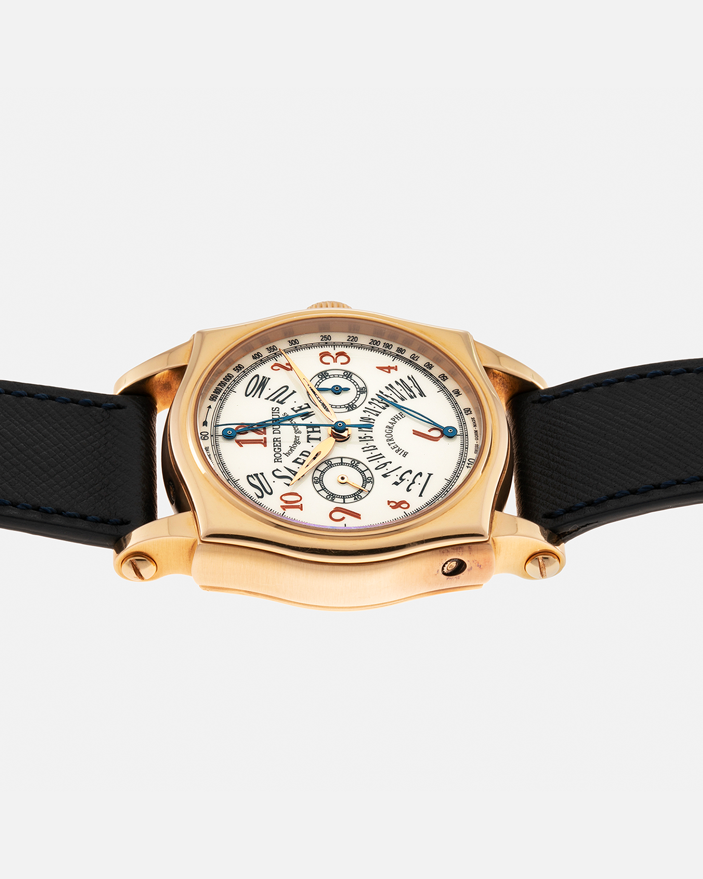 Brand: Roger Dubuis Year: 2000’s Model: Sympathie 40 Biretrograde Chronograph Material: 18-carat Yellow Gold Movement: Roger Dubuis Cal. RD 5630 (Based on the Lemania Cal. 2310), Manual-Winding Case Diameter: 40mm Strap: Molequin Navy Blue Textured Calf Leather Strap with Signed 18-carat Yellow Gold Roger Dubuis Tang Buckle