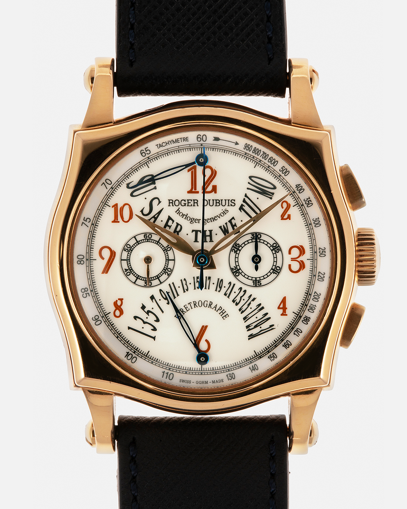 Brand: Roger Dubuis
Year: 2000s
Model: Sympathie 40 Biretrograde Chronograph
Material: 18-carat Yellow Gold
Movement: Roger Dubuis Cal. RD 5630 (Based on the Lemania Cal. 2310), Manual-Winding
Case Dimensions: 40mm x 12.25mm (Lug-to-Lug 47mm)
Lug Width: 22mm
Strap: Molequin Navy Blue Textured Calf Leather Strap with Signed 18-carat Yellow Gold Tang Buckle