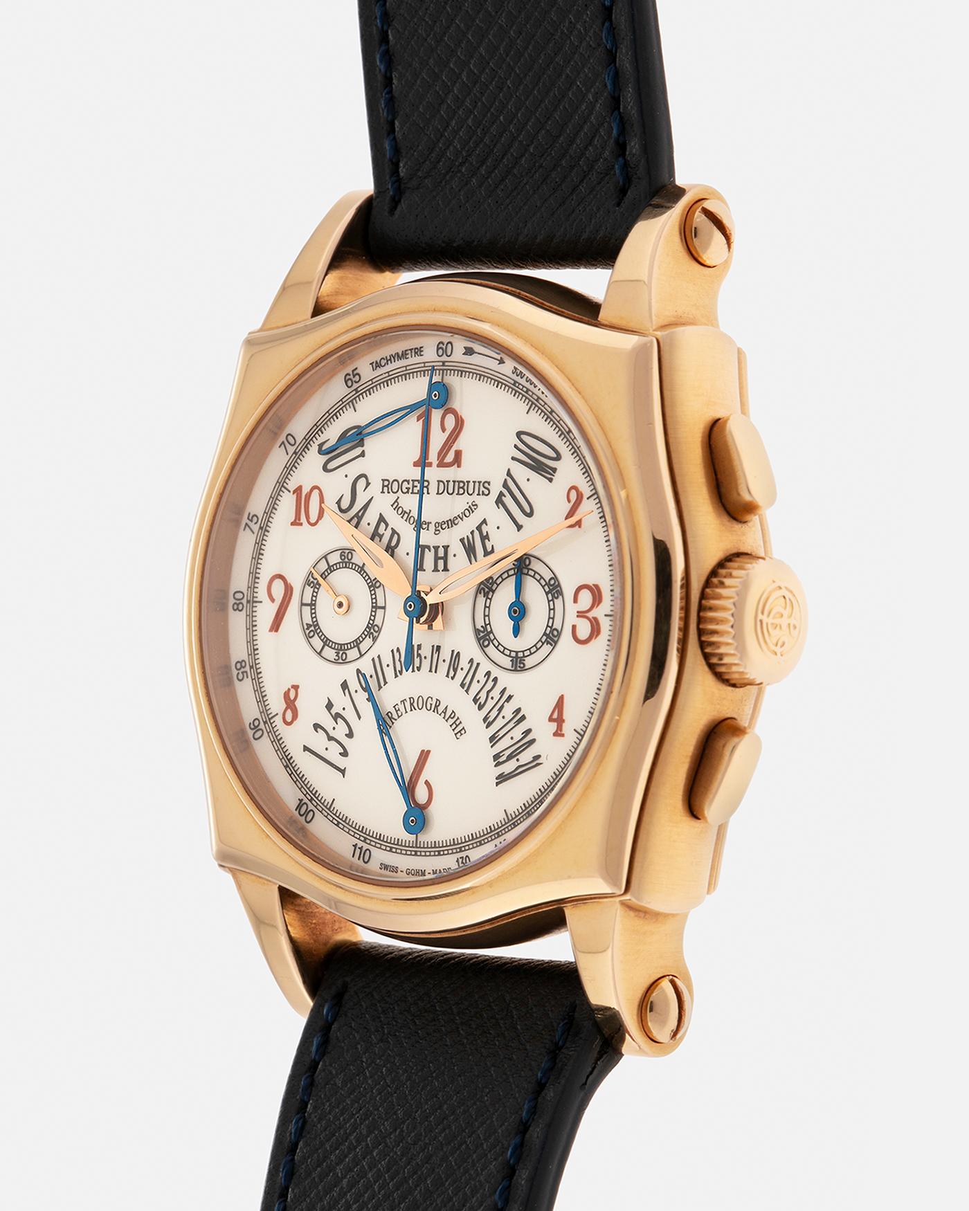 Brand: Roger Dubuis
Year: 2000s
Model: Sympathie 40 Biretrograde Chronograph
Material: 18-carat Yellow Gold
Movement: Roger Dubuis Cal. RD 5630 (Based on the Lemania Cal. 2310), Manual-Winding
Case Dimensions: 40mm x 12.25mm (Lug-to-Lug 47mm)
Lug Width: 22mm
Strap: Molequin Navy Blue Textured Calf Leather Strap with Signed 18-carat Yellow Gold Tang Buckle