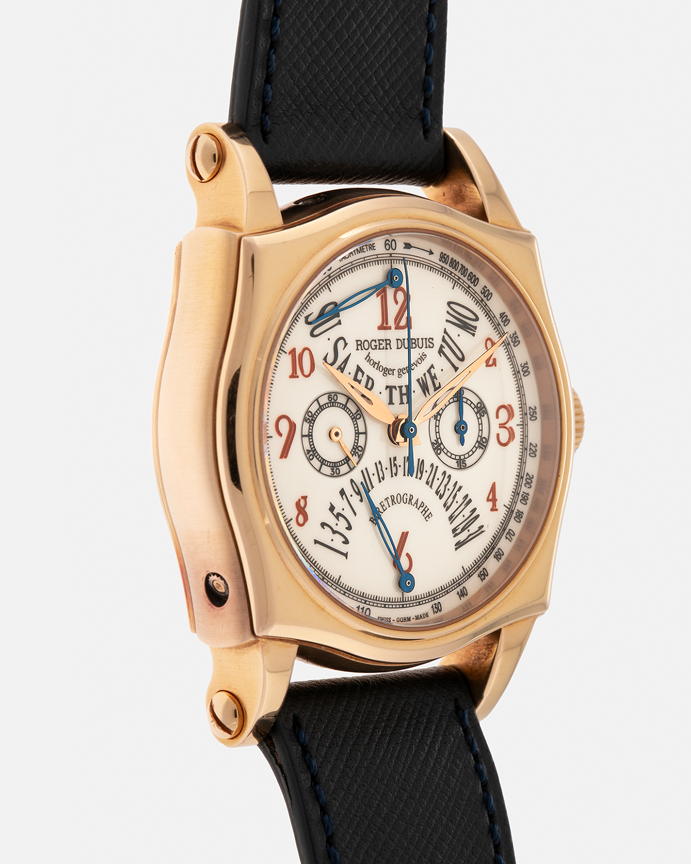 Brand: Roger Dubuis
Year: 2000s
Model: Sympathie 40 Biretrograde Chronograph
Material: 18-carat Yellow Gold
Movement: Roger Dubuis Cal. RD 5630 (Based on the Lemania Cal. 2310), Manual-Winding
Case Dimensions: 40mm x 12.25mm (Lug-to-Lug 47mm)
Lug Width: 22mm
Strap: Molequin Navy Blue Textured Calf Leather Strap with Signed 18-carat Yellow Gold Tang Buckle