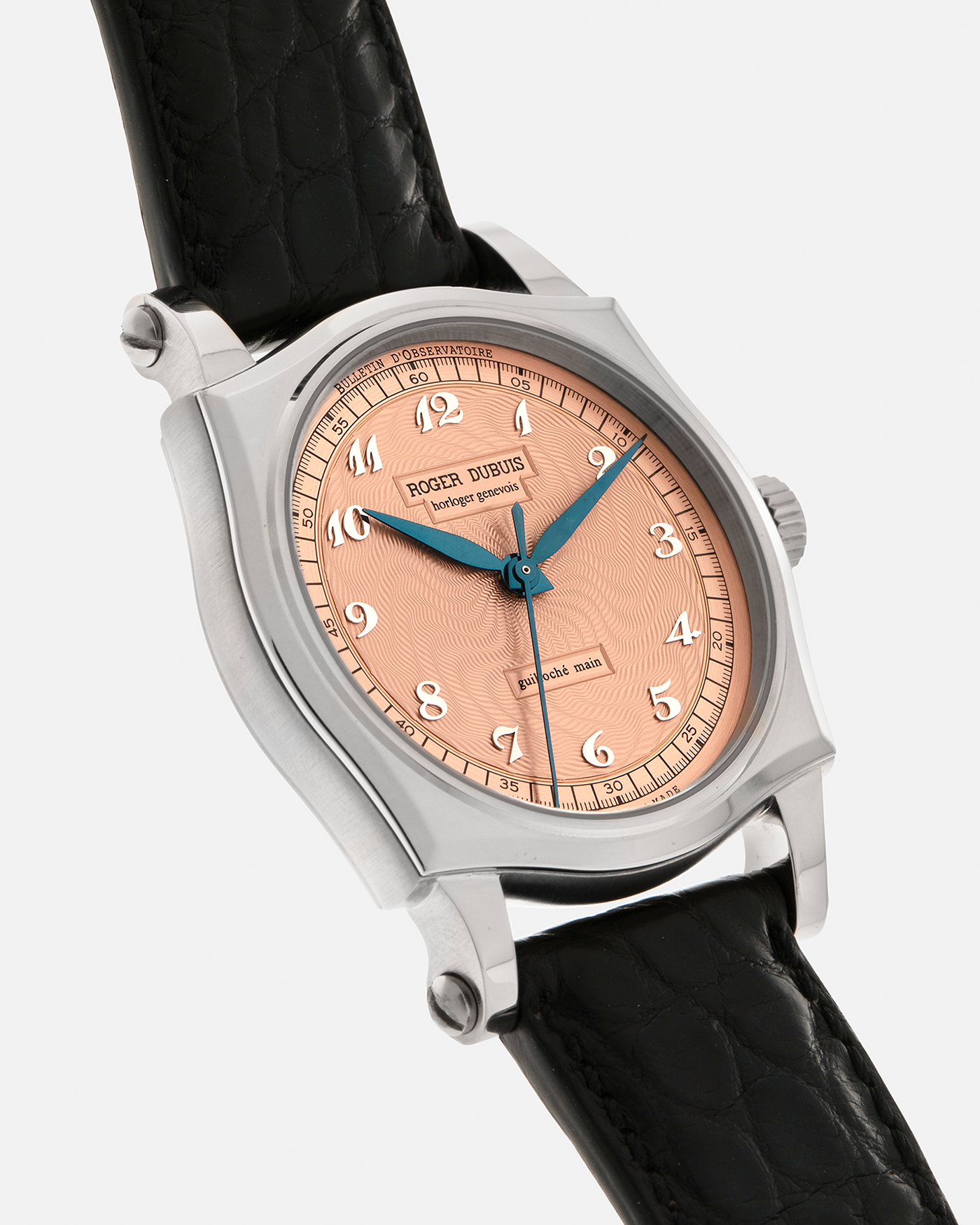 Brand: Roger Dubuis
Year: 2001
Model: Sympathie 37 ‘Salmon Guilloché’, Limited to 28 Pieces
Reference: S37.57.0
Material: 18-carat White Gold
Movement: Roger Dubuis Cal. RD 57, Self-Winding
Case Dimensions: 37mm x 8.5mm (Lug-to-Lug 46.5mm)
Lug Width: 20mm
Strap: Roger Dubuis Black Crocodile Leather Strap with Signed 18-carat White Gold Tang Buckle