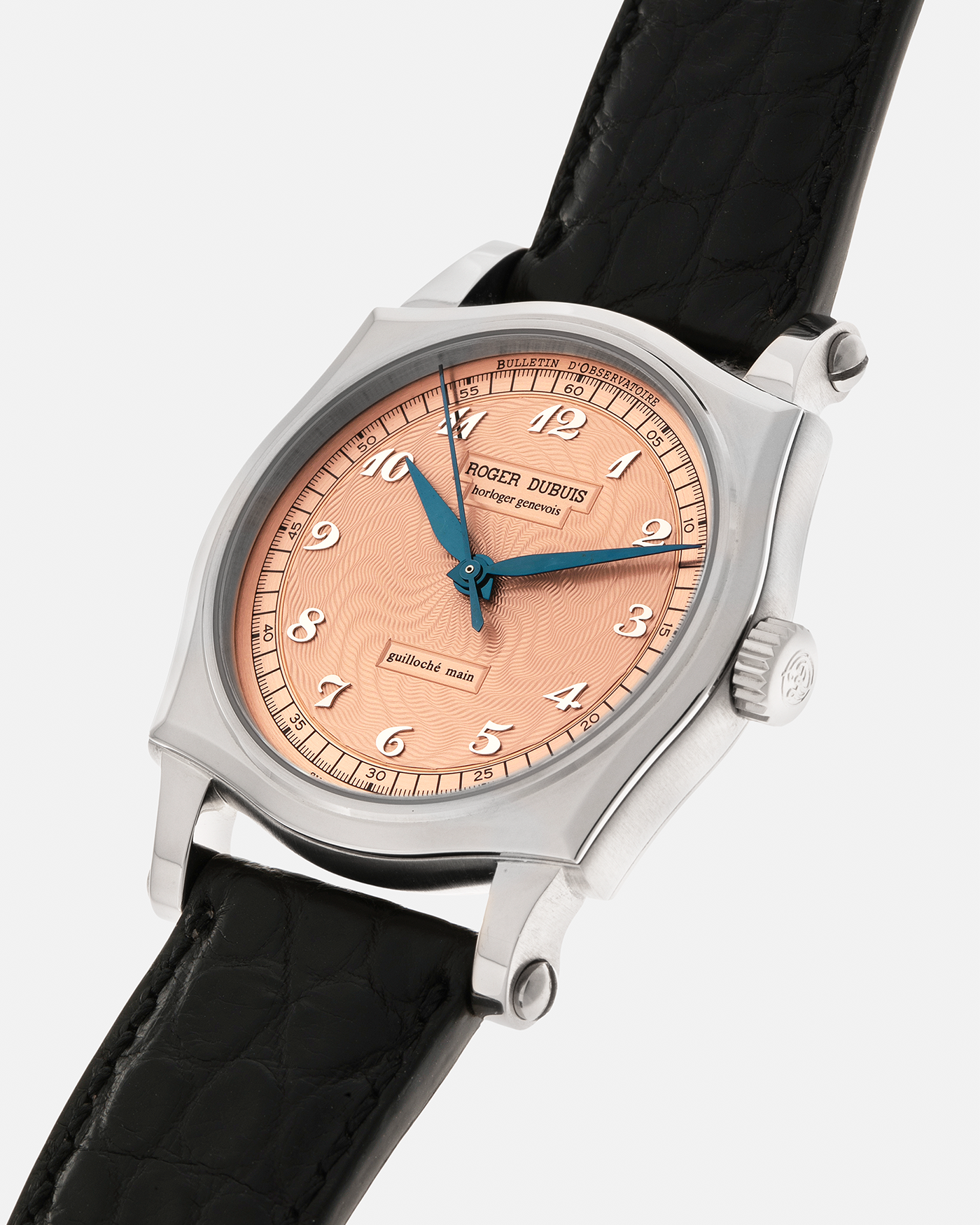 Brand: Roger Dubuis
Year: 2001
Model: Sympathie 37 ‘Salmon Guilloché’, Limited to 28 Pieces
Reference: S37.57.0
Material: 18-carat White Gold
Movement: Roger Dubuis Cal. RD 57, Self-Winding
Case Dimensions: 37mm x 8.5mm (Lug-to-Lug 46.5mm)
Lug Width: 20mm
Strap: Roger Dubuis Black Crocodile Leather Strap with Signed 18-carat White Gold Tang Buckle