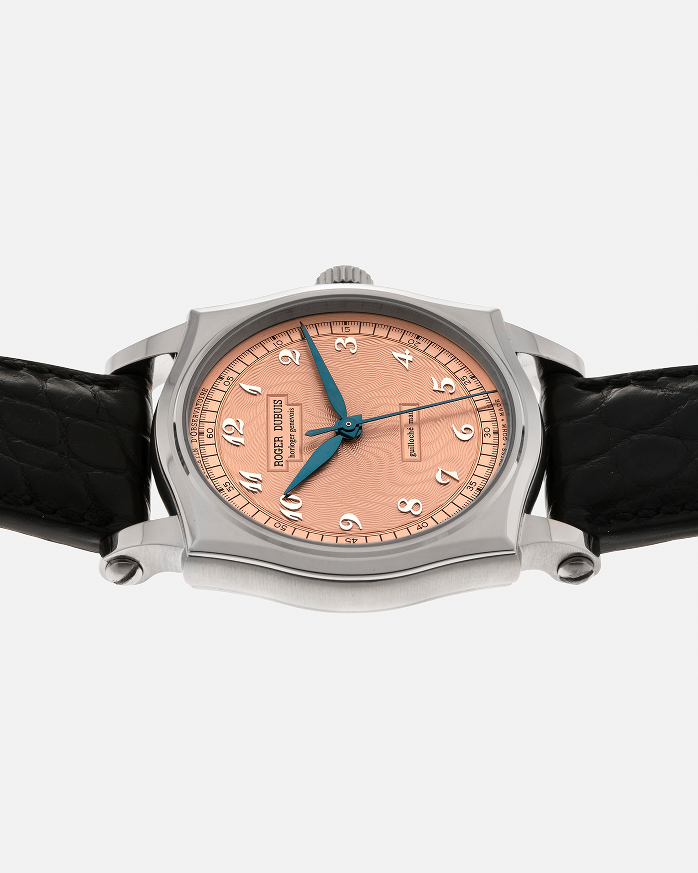 Brand: Roger Dubuis
Year: 2001
Model: Sympathie 37 ‘Salmon Guilloché’, Limited to 28 Pieces
Reference: S37.57.0
Material: 18-carat White Gold
Movement: Roger Dubuis Cal. RD 57, Self-Winding
Case Dimensions: 37mm x 8.5mm (Lug-to-Lug 46.5mm)
Lug Width: 20mm
Strap: Roger Dubuis Black Crocodile Leather Strap with Signed 18-carat White Gold Tang Buckle