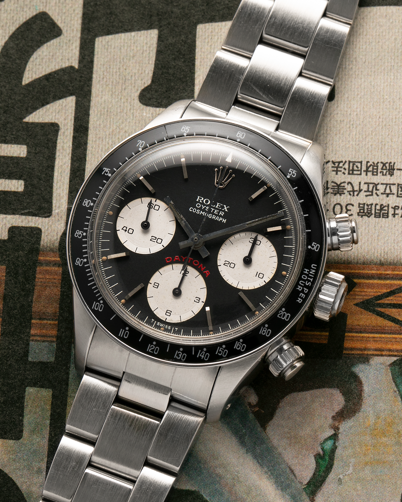 Brand: Rolex
Year: 1979
Model: Cosmograph Daytona ‘Big Red’
Serial Number: 584XXXX
Reference Number: 6263
Material: Stainless Steel
Movement: Rolex-Signed Valjoux Cal. 727, Manual-Winding
Case Dimensions: 37.5mm x 13.5mm (Lug-to-Lug 45mm)
Lug Width: 19mm
Bracelet: Rolex 78350 Solid Link Oyster Bracelet in Stainless Steel with Signed Clasp