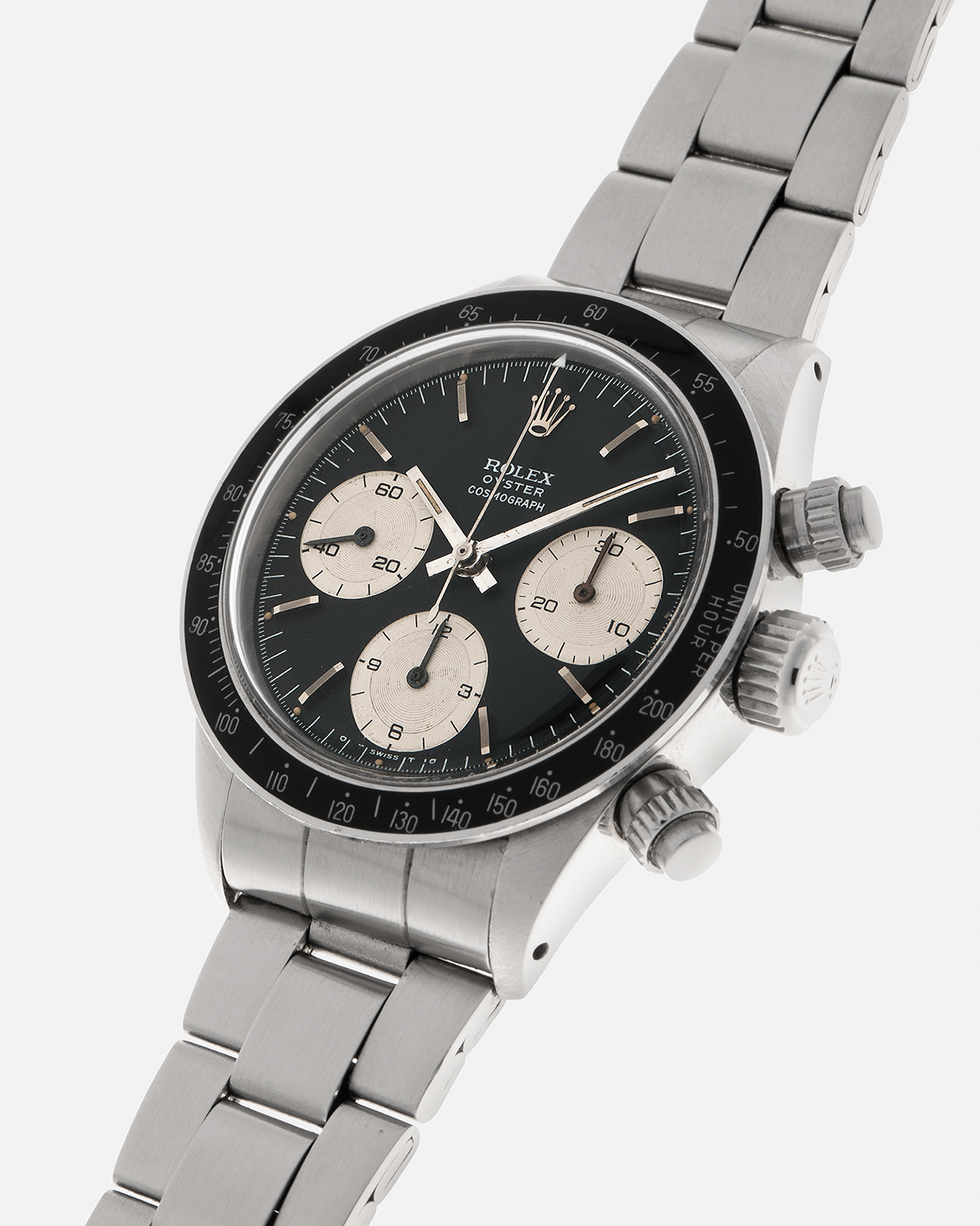 Brand: Rolex
Year: 1974
Model: Cosmograph Daytona
Serial Number: 373XXXX
Reference Number: 6263
Material: Stainless Steel Case, Acrylic Bezel Insert, Gold Hands and Hour Markers
Movement: Rolex-Signed Valjoux Cal. 727, Manual-Winding
Case Dimensions: 37.5mm x 13.5mm (Lug-to-Lug 45mm)
Lug Width: 19mm
Bracelet: Rolex 7835 Folded Oyster Bracelet in Stainless Steel with ‘371’ Curved End Links and Signed Clasp