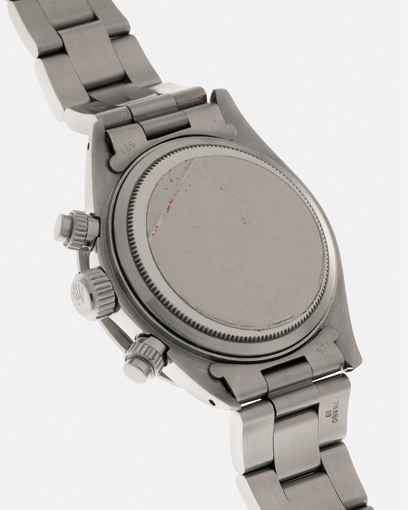 Brand: Rolex
Year: 1979
Model: Cosmograph Daytona ‘Big Red’
Serial Number: 629XXXX
Reference Number: 6263
Material: Stainless Steel
Movement: Rolex-Signed Valjoux Cal. 727, Manual-Winding
Case Dimensions: 37.5mm x 13.5mm (Lug-to-Lug 45mm)
Lug Width: 19mm
Bracelet: Rolex 78350 Solid Link Oyster Bracelet in Stainless Steel with ‘571’ Curved End Links and ‘F’ Signed Clasp