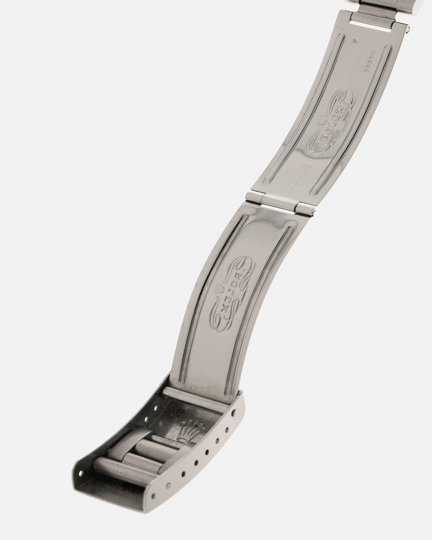 Brand: Rolex
Year: 1979
Model: Cosmograph Daytona ‘Big Red’
Serial Number: 629XXXX
Reference Number: 6263
Material: Stainless Steel
Movement: Rolex-Signed Valjoux Cal. 727, Manual-Winding
Case Dimensions: 37.5mm x 13.5mm (Lug-to-Lug 45mm)
Lug Width: 19mm
Bracelet: Rolex 78350 Solid Link Oyster Bracelet in Stainless Steel with ‘571’ Curved End Links and ‘F’ Signed Clasp