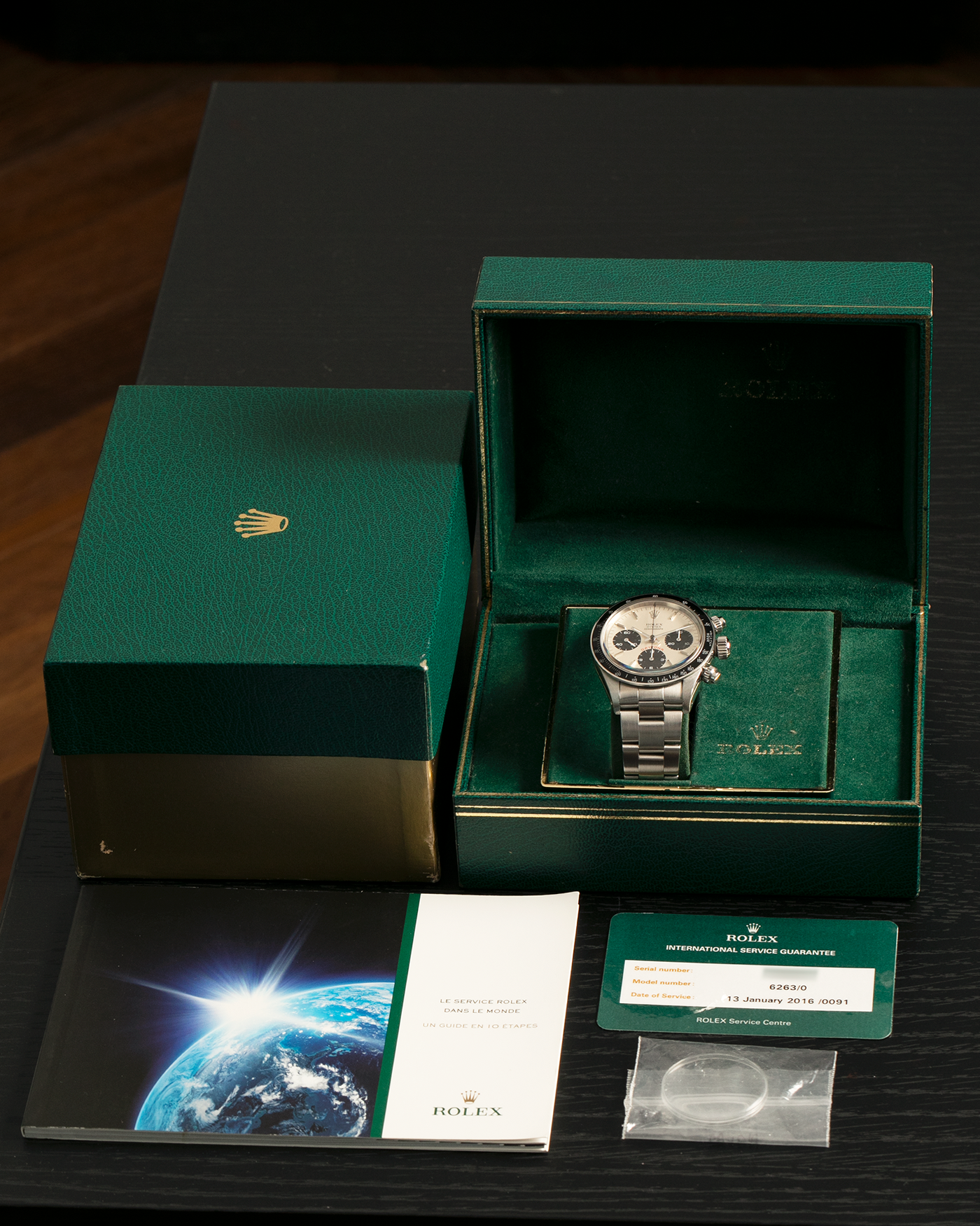 Brand: Rolex
Year: 1979
Model: Cosmograph Daytona ‘Big Red’
Serial Number: 629XXXX
Reference Number: 6263
Material: Stainless Steel
Movement: Rolex-Signed Valjoux Cal. 727, Manual-Winding
Case Dimensions: 37.5mm x 13.5mm (Lug-to-Lug 45mm)
Lug Width: 19mm
Bracelet: Rolex 78350 Solid Link Oyster Bracelet in Stainless Steel with ‘571’ Curved End Links and ‘F’ Signed Clasp