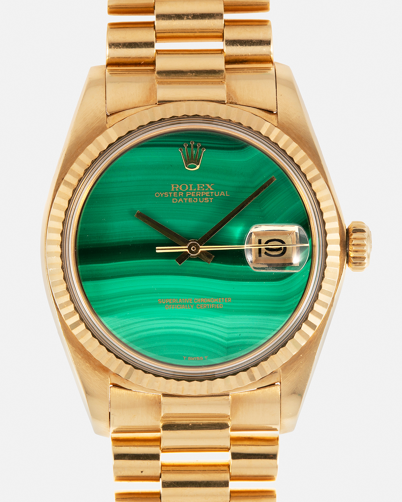 Brand: Rolex Year: 1976 Model: Datejust Reference Number: 1601 Serial Number: 420XXXX Material: 18-carat Yellow Gold, Malachite Stone Dial Movement: Rolex Cal. 1570, Self-Winding Case Diameter: 36mm Lug Width: 20mm Bracelet: Rolex Presidential Bracelet in 18-carat Yellow Gold with Signed Clasp