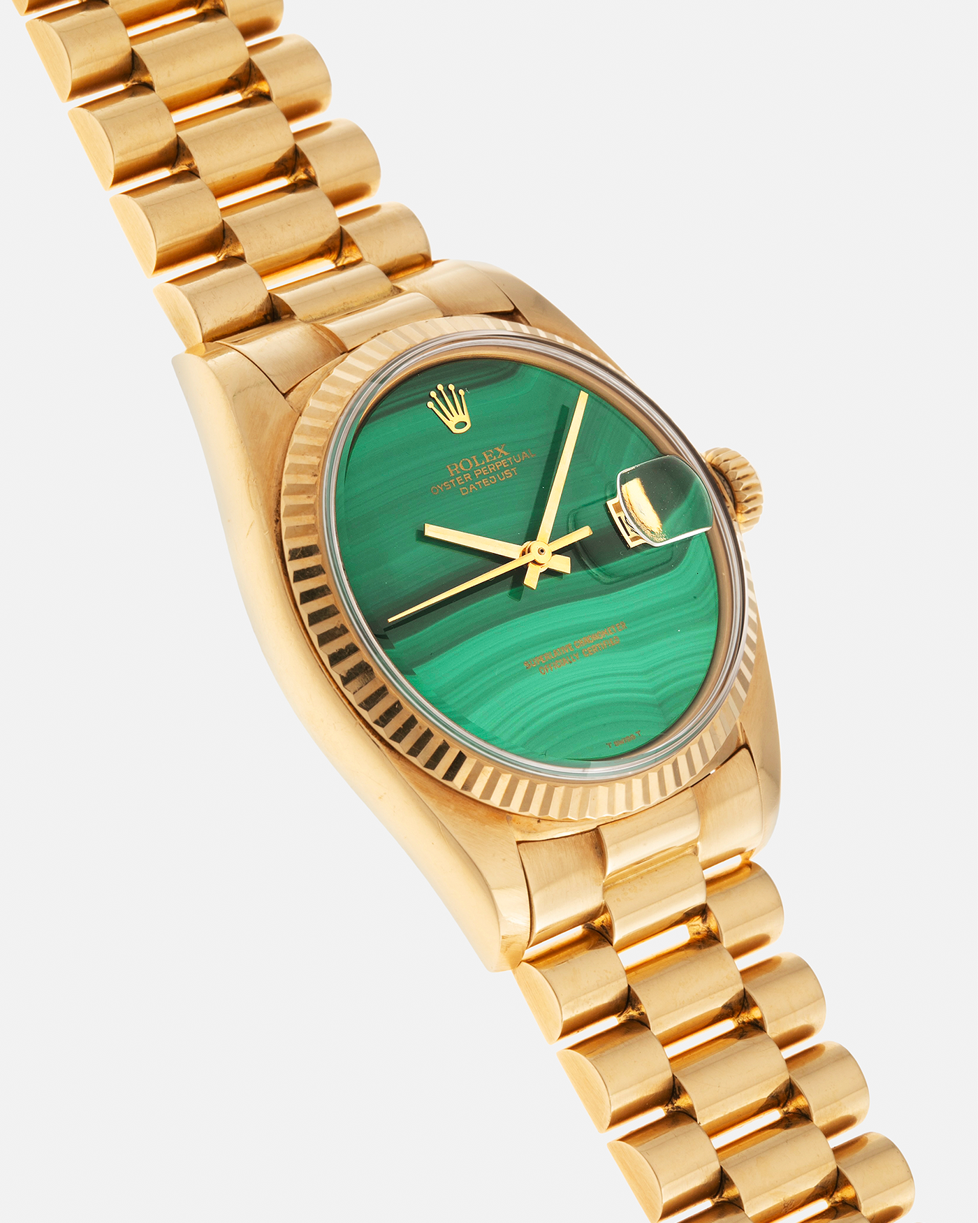 Brand: Rolex Year: 1976 Model: Datejust Reference Number: 1601 Serial Number: 420XXXX Material: 18-carat Yellow Gold, Malachite Stone Dial Movement: Rolex Cal. 1570, Self-Winding Case Diameter: 36mm Lug Width: 20mm Bracelet: Rolex Presidential Bracelet in 18-carat Yellow Gold with Signed Clasp