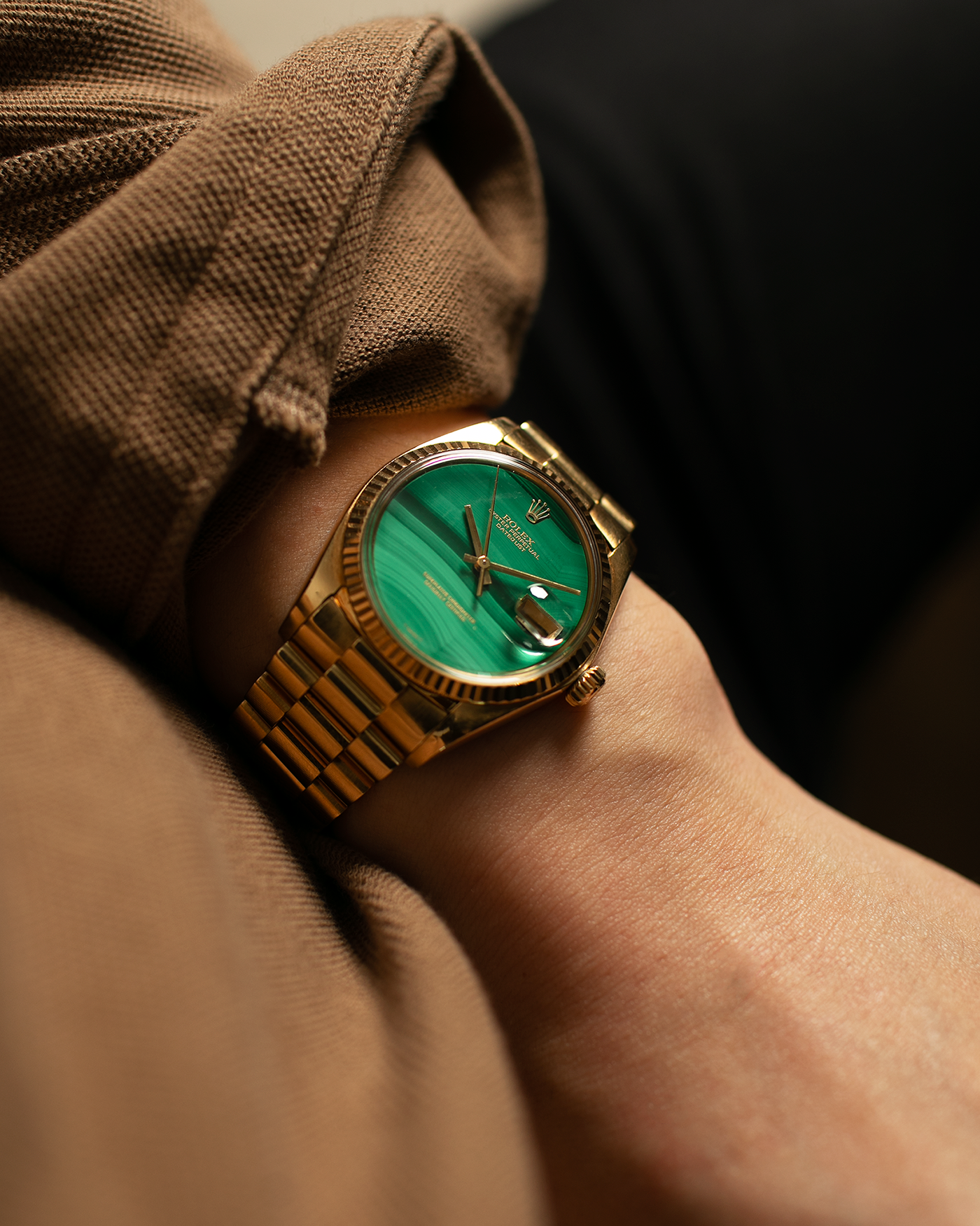 Brand: Rolex Year: 1976 Model: Datejust Reference Number: 1601 Serial Number: 420XXXX Material: 18-carat Yellow Gold, Malachite Stone Dial Movement: Rolex Cal. 1570, Self-Winding Case Diameter: 36mm Lug Width: 20mm Bracelet: Rolex Presidential Bracelet in 18-carat Yellow Gold with Signed Clasp