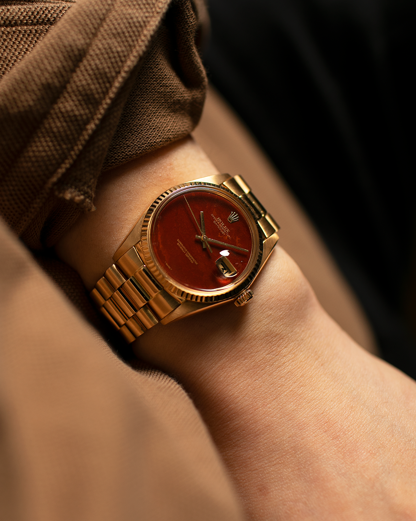 Brand: Rolex Year: 1975 Model: Datejust Reference Number: 1601/8 Serial Number: 392XXXX Material: 18-carat Yellow Gold, Red Jasper Stone Dial Movement: Rolex Cal. 1565, Self-Winding Case Diameter: 36mm Lug Width: 20mm Bracelet: Rolex 18-carat Yellow Gold 8385 Presidential Bracelet with 55B Curved End Links