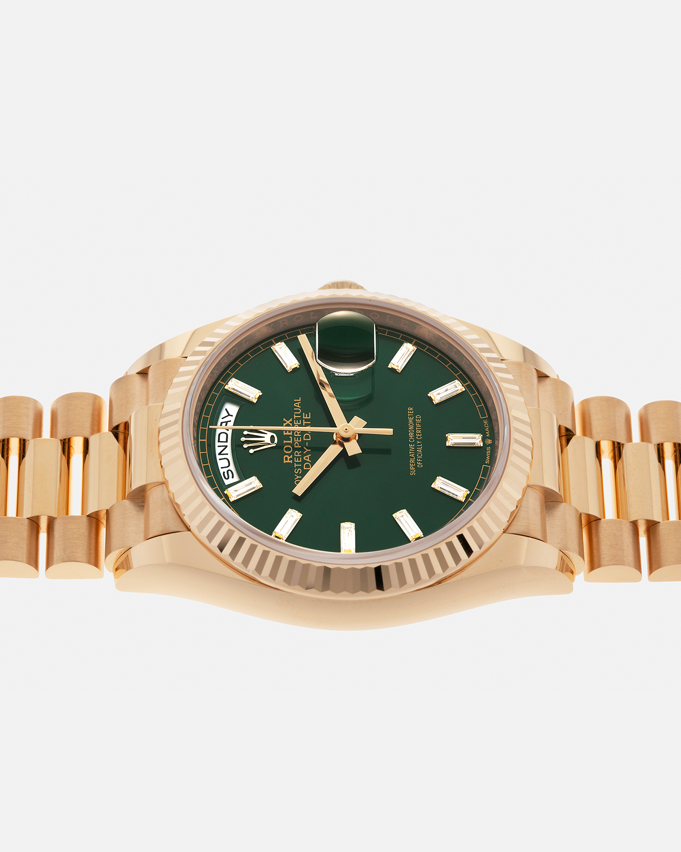 Brand: Rolex
Year: 2024
Model: Day-Date 36 ‘Baguette Diamonds’
Reference Number: 128238
Material: 18-carat Yellow Gold Case, Factory Set Baguette Diamond Hour Markers
Movement: Rolex Cal. 3255, Self-Winding
Case Dimensions: 36mm x 12mm (Lug-to-Lug 43mm)
Lug Width: 20mm
Bracelet: Rolex Presidential Bracelet in 18-carat Yellow Gold with Signed Folding Clasp
