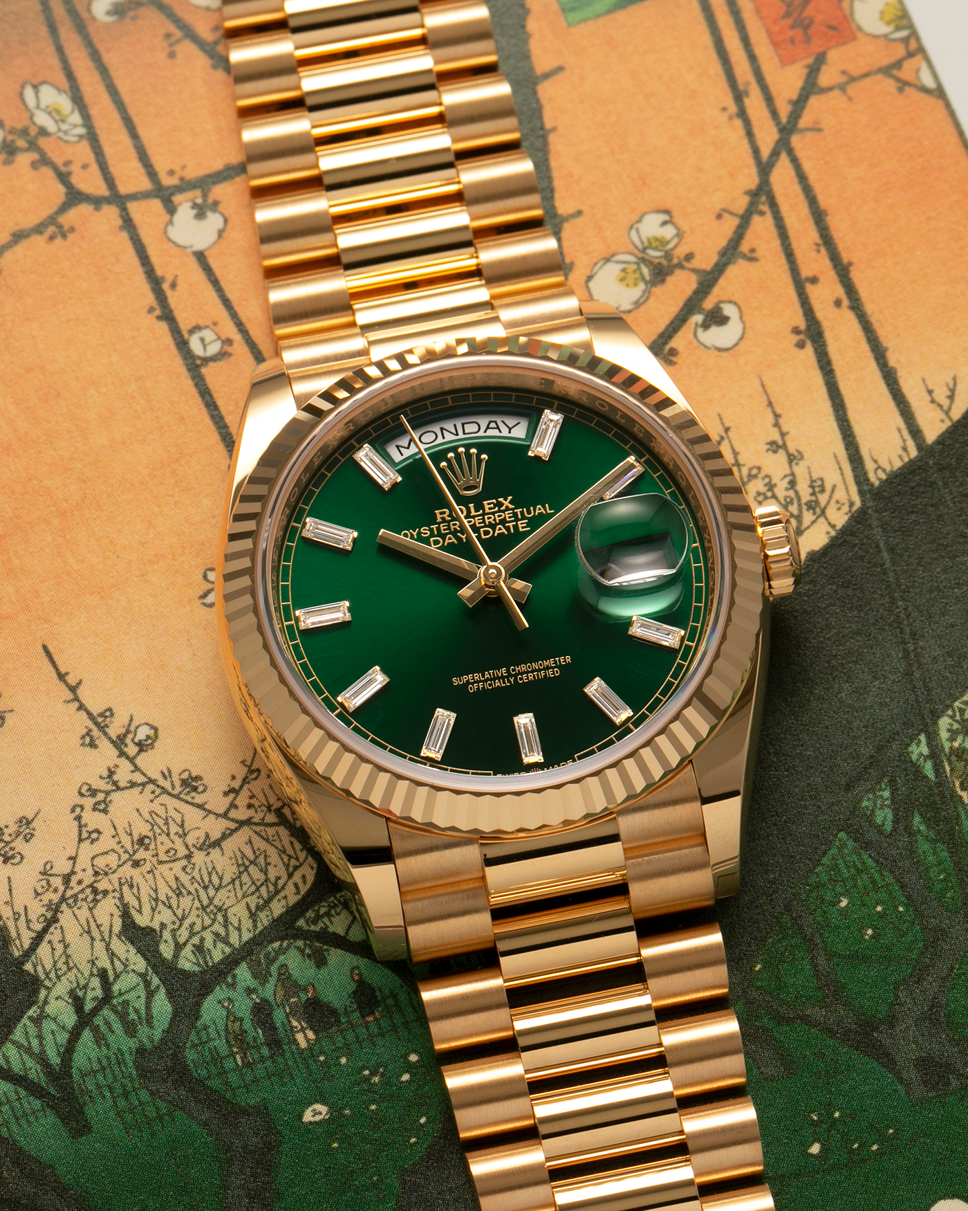 Brand: Rolex
Year: 2024
Model: Day-Date 36 ‘Baguette Diamonds’
Reference Number: 128238
Material: 18-carat Yellow Gold Case, Factory Set Baguette Diamond Hour Markers
Movement: Rolex Cal. 3255, Self-Winding
Case Dimensions: 36mm x 12mm (Lug-to-Lug 43mm)
Lug Width: 20mm
Bracelet: Rolex Presidential Bracelet in 18-carat Yellow Gold with Signed Folding Clasp