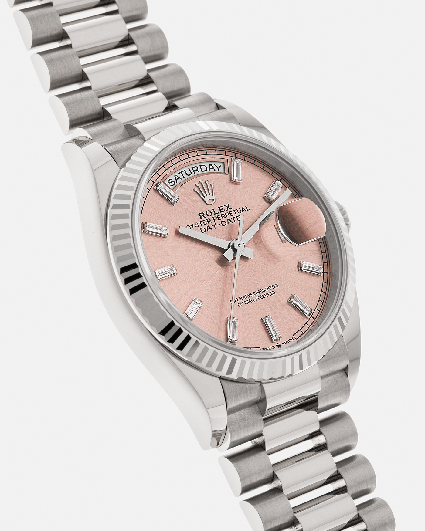 Brand: Rolex
Year: 2025
Model: Day-Date 36 ‘Baguette Diamonds’
Reference Number: 128239
Material: 18-carat White Gold Case, Factory Set Baguette Diamond Hour Markers
Movement: Rolex Cal. 3255, Self-Winding
Case Dimensions: 36mm x 12mm (Lug-to-Lug 43mm)
Lug Width: 20mm
Bracelet: Rolex Presidential Bracelet in 18-carat White Gold with Signed Folding Clasp