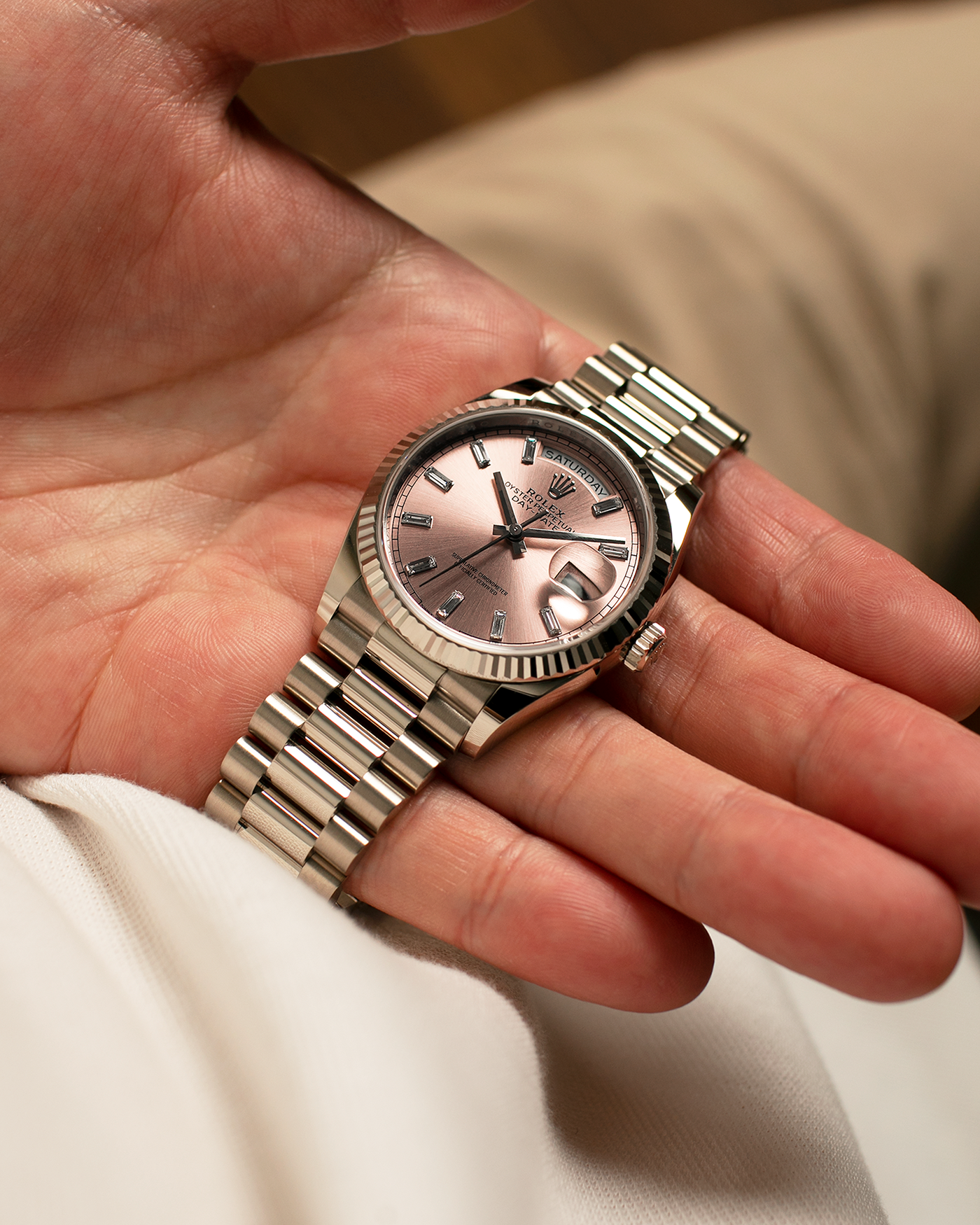Brand: Rolex
Year: 2025
Model: Day-Date 36 ‘Baguette Diamonds’
Reference Number: 128239
Material: 18-carat White Gold Case, Factory Set Baguette Diamond Hour Markers
Movement: Rolex Cal. 3255, Self-Winding
Case Dimensions: 36mm x 12mm (Lug-to-Lug 43mm)
Lug Width: 20mm
Bracelet: Rolex Presidential Bracelet in 18-carat White Gold with Signed Folding Clasp