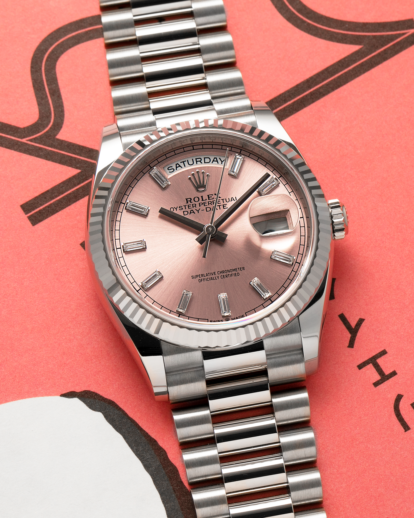 Brand: Rolex
Year: 2025
Model: Day-Date 36 ‘Baguette Diamonds’
Reference Number: 128239
Material: 18-carat White Gold Case, Factory Set Baguette Diamond Hour Markers
Movement: Rolex Cal. 3255, Self-Winding
Case Dimensions: 36mm x 12mm (Lug-to-Lug 43mm)
Lug Width: 20mm
Bracelet: Rolex Presidential Bracelet in 18-carat White Gold with Signed Folding Clasp