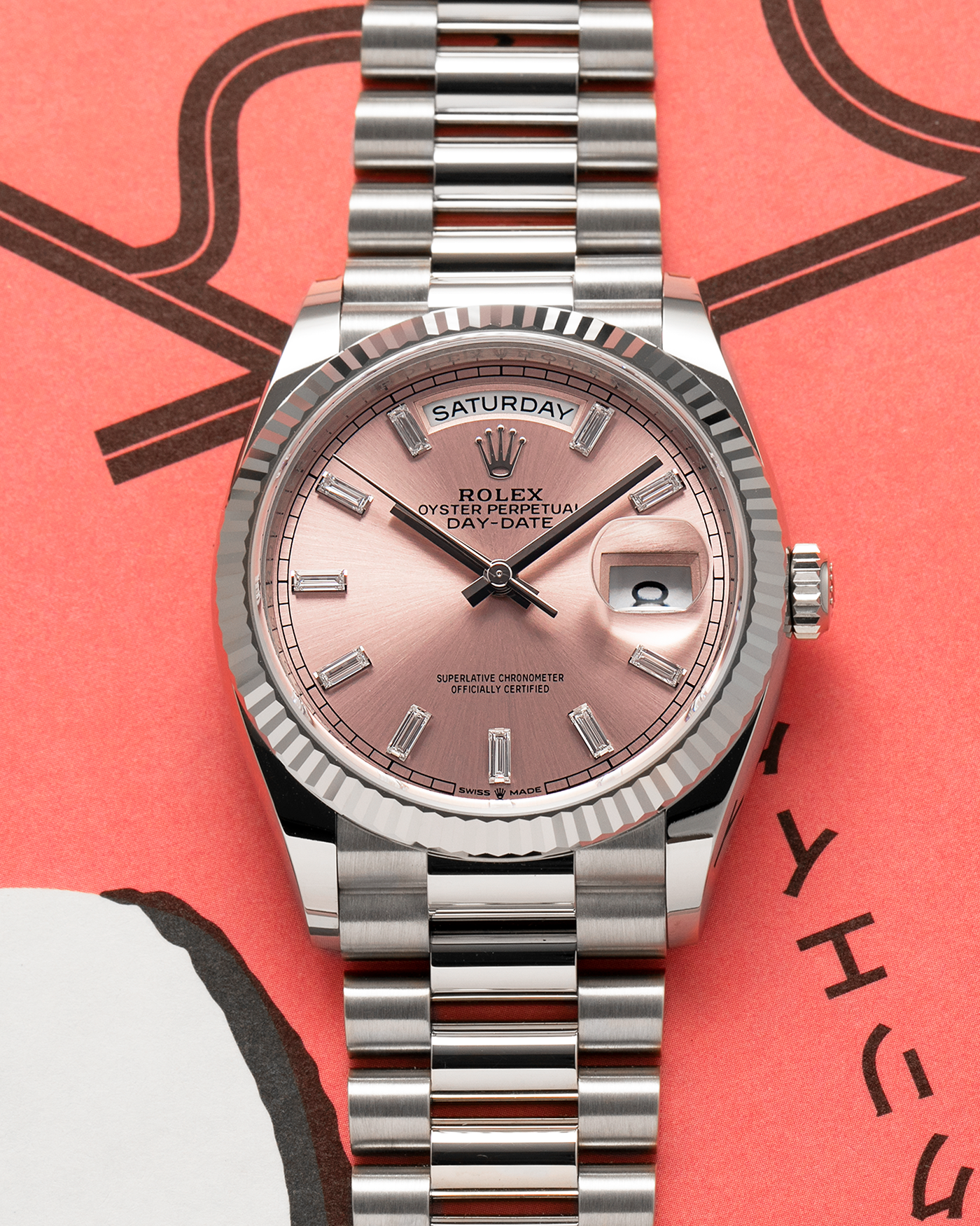Brand: Rolex
Year: 2025
Model: Day-Date 36 ‘Baguette Diamonds’
Reference Number: 128239
Material: 18-carat White Gold Case, Factory Set Baguette Diamond Hour Markers
Movement: Rolex Cal. 3255, Self-Winding
Case Dimensions: 36mm x 12mm (Lug-to-Lug 43mm)
Lug Width: 20mm
Bracelet: Rolex Presidential Bracelet in 18-carat White Gold with Signed Folding Clasp
