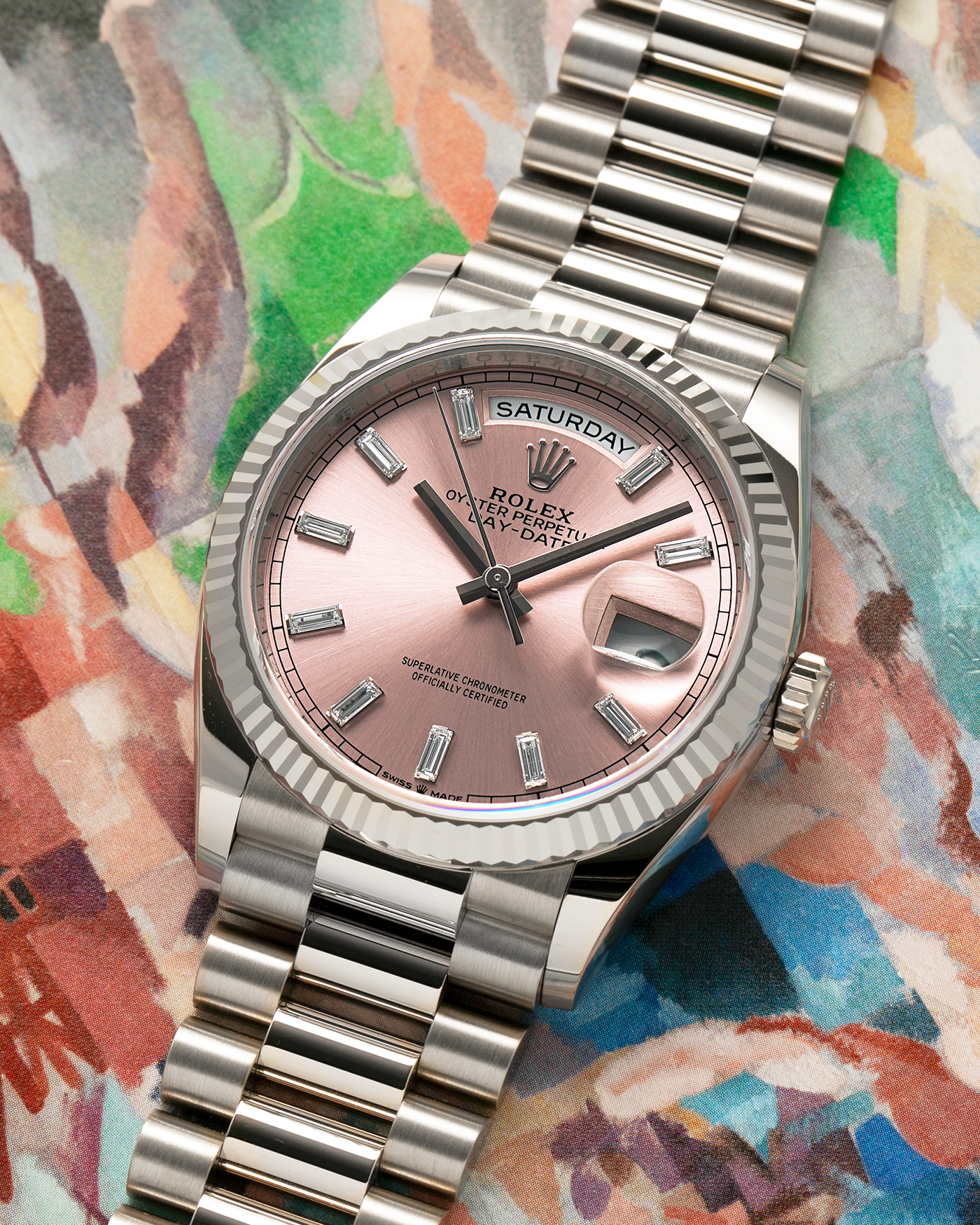 Brand: Rolex
Year: 2025
Model: Day-Date 36 ‘Baguette Diamonds’
Reference Number: 128239
Material: 18-carat White Gold Case, Factory Set Baguette Diamond Hour Markers
Movement: Rolex Cal. 3255, Self-Winding
Case Dimensions: 36mm x 12mm (Lug-to-Lug 43mm)
Lug Width: 20mm
Bracelet: Rolex Presidential Bracelet in 18-carat White Gold with Signed Folding Clasp