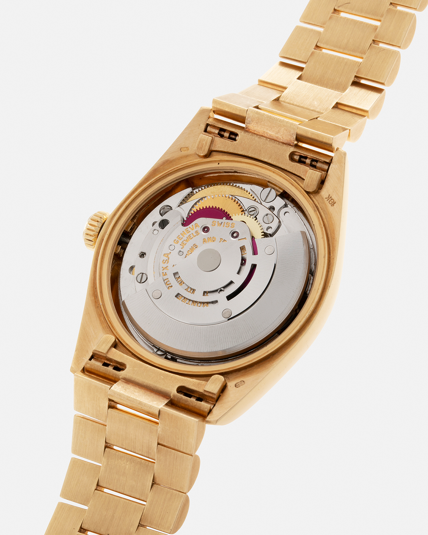 Brand: Rolex Year: 1978 Model: Day-Date, Coral Red ‘Stella’ Reference Number: 1803 Serial: 510XXXX Material: 18-carat Yellow Gold Movement: Rolex Cal. 1556, Self-Winding Case Diameter: 36mm Lug Width: 20mm Bracelet: Rolex 18-carat Yellow Gold ‘F18000’ Stamped Presidential Bracelet with ‘55’ Curved End Links