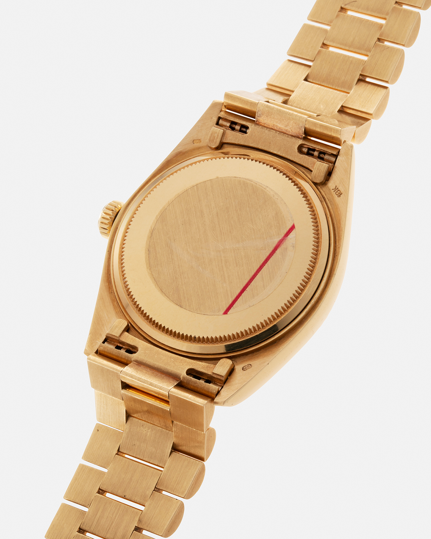Brand: Rolex Year: 1978 Model: Day-Date, Coral Red ‘Stella’ Reference Number: 1803 Serial: 510XXXX Material: 18-carat Yellow Gold Movement: Rolex Cal. 1556, Self-Winding Case Diameter: 36mm Lug Width: 20mm Bracelet: Rolex 18-carat Yellow Gold ‘F18000’ Stamped Presidential Bracelet with ‘55’ Curved End Links