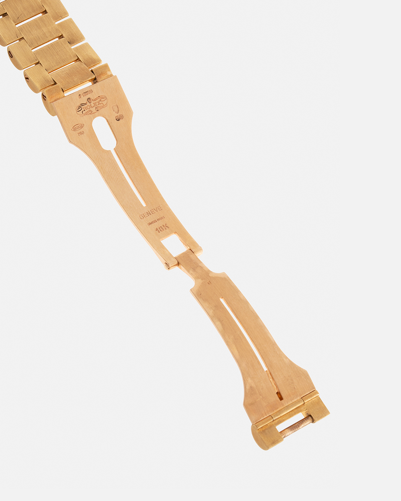 Brand: Rolex Year: 1978 Model: Day-Date, Coral Red ‘Stella’ Reference Number: 1803 Serial: 510XXXX Material: 18-carat Yellow Gold Movement: Rolex Cal. 1556, Self-Winding Case Diameter: 36mm Lug Width: 20mm Bracelet: Rolex 18-carat Yellow Gold ‘F18000’ Stamped Presidential Bracelet with ‘55’ Curved End Links