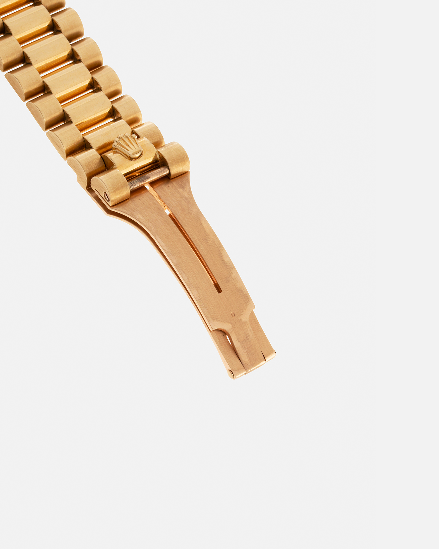 Brand: Rolex Year: 1978 Model: Day-Date, Coral Red ‘Stella’ Reference Number: 1803 Serial: 510XXXX Material: 18-carat Yellow Gold Movement: Rolex Cal. 1556, Self-Winding Case Diameter: 36mm Lug Width: 20mm Bracelet: Rolex 18-carat Yellow Gold ‘F18000’ Stamped Presidential Bracelet with ‘55’ Curved End Links