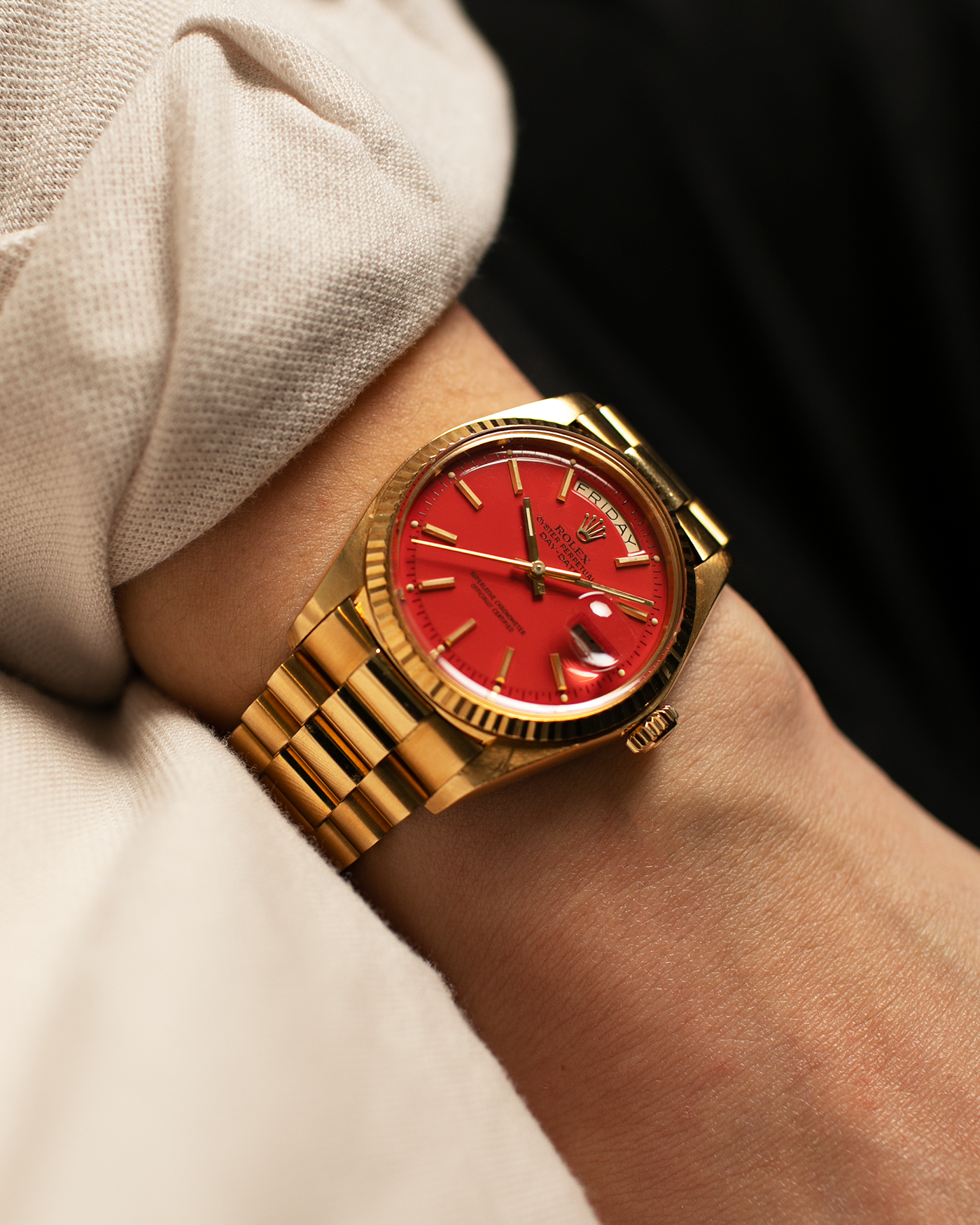 Brand: Rolex Year: 1978 Model: Day-Date, Coral Red ‘Stella’ Reference Number: 1803 Serial: 510XXXX Material: 18-carat Yellow Gold Movement: Rolex Cal. 1556, Self-Winding Case Diameter: 36mm Lug Width: 20mm Bracelet: Rolex 18-carat Yellow Gold ‘F18000’ Stamped Presidential Bracelet with ‘55’ Curved End Links