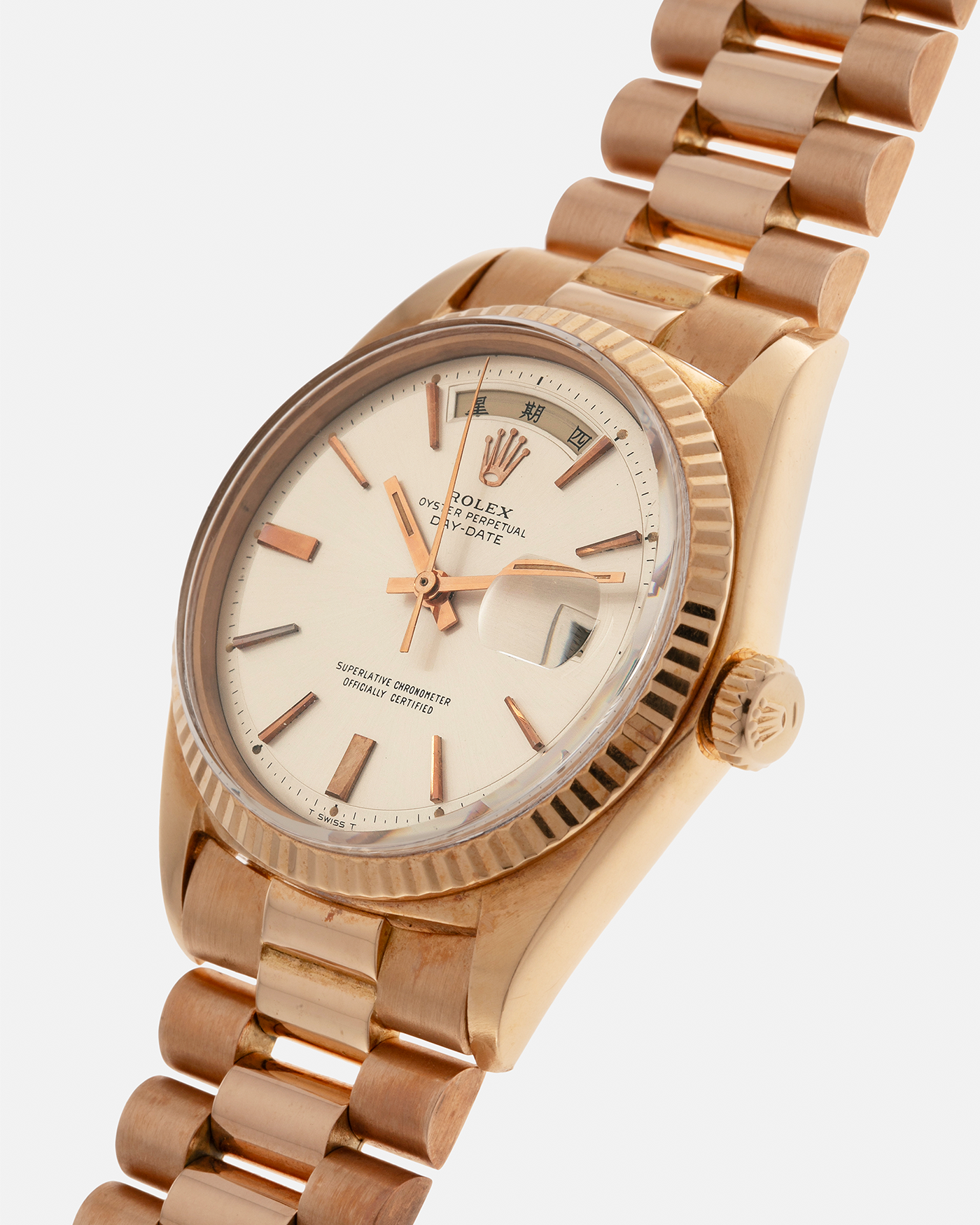 Brand: Rolex
Year: 1968
Model: Day-Date, ‘Doorstop’ Dial
Reference Number: 1803
Serial: 178XXXX
Material: 18-carat Rose Gold
Movement: Rolex Cal. 1556, Self-Winding
Case Dimensions: 36mm x 12.5mm (Lug-to-Lug 43mm)
Lug Width: 20mm
Bracelet: Rolex Presidential Bracelet in 18-carat Rose Gold with Signed Folding Clasp
