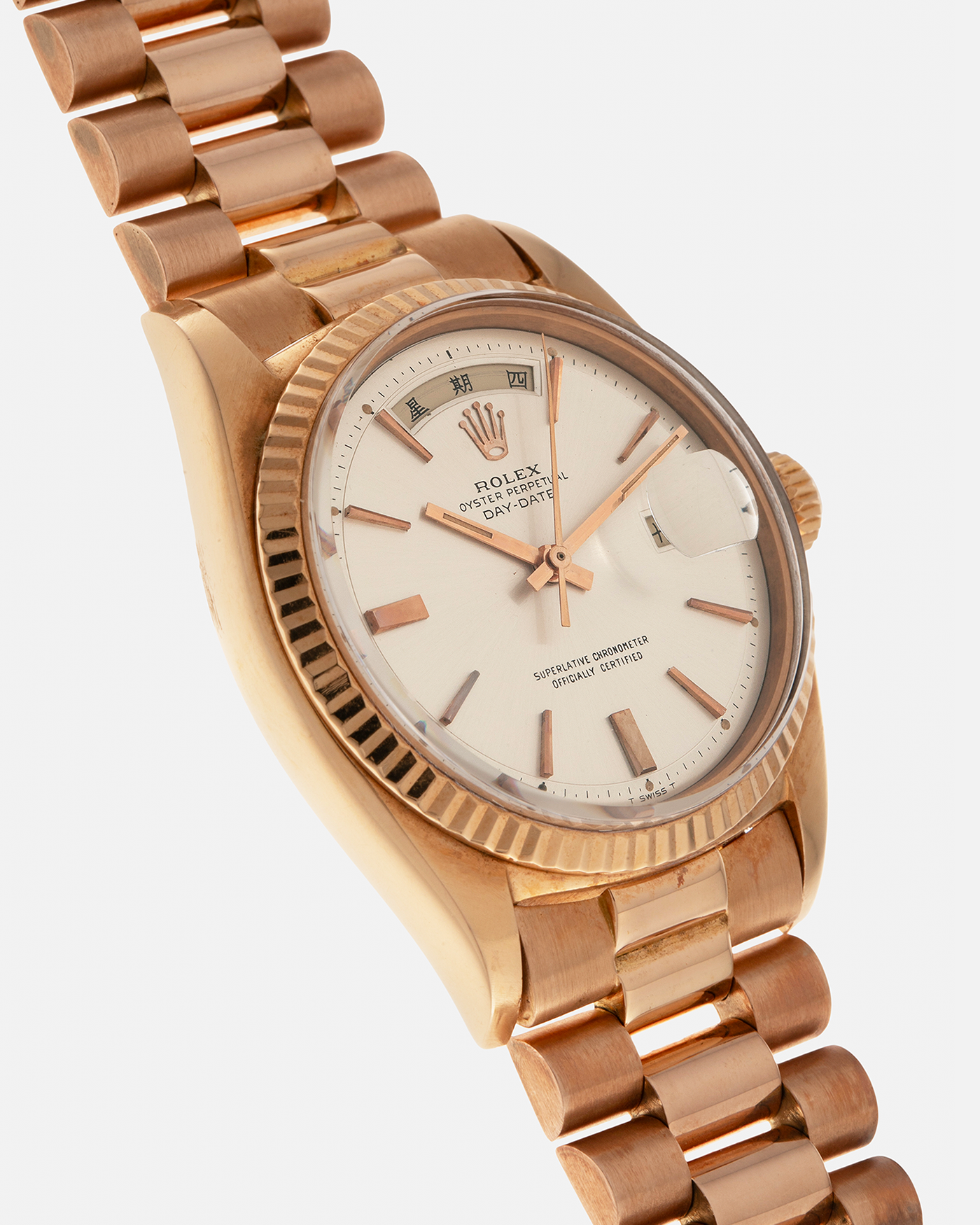 Brand: Rolex
Year: 1968
Model: Day-Date, ‘Doorstop’ Dial
Reference Number: 1803
Serial: 178XXXX
Material: 18-carat Rose Gold
Movement: Rolex Cal. 1556, Self-Winding
Case Dimensions: 36mm x 12.5mm (Lug-to-Lug 43mm)
Lug Width: 20mm
Bracelet: Rolex Presidential Bracelet in 18-carat Rose Gold with Signed Folding Clasp