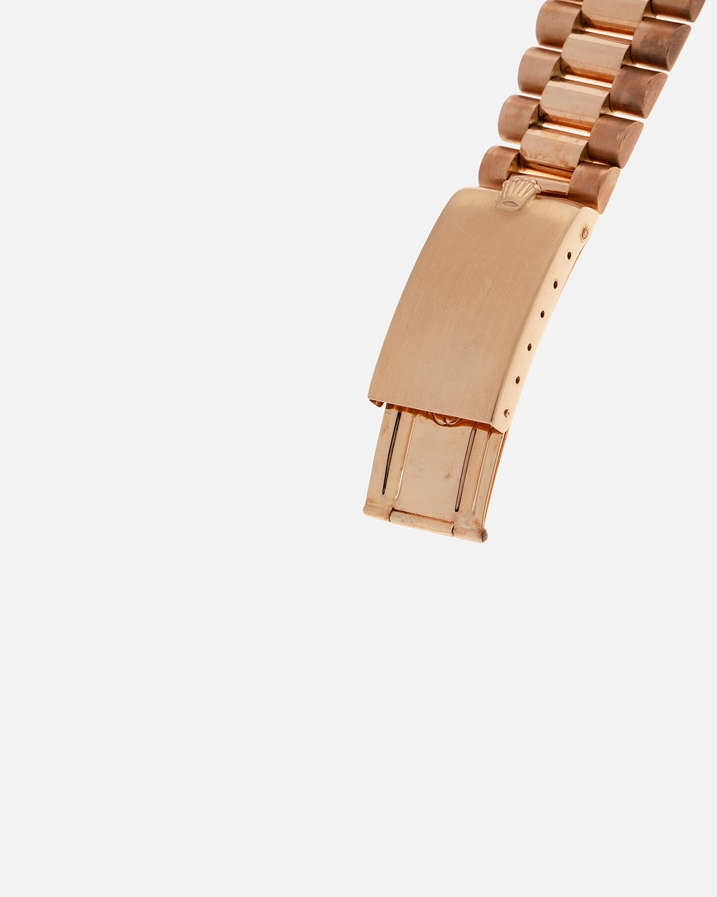 Brand: Rolex
Year: 1968
Model: Day-Date, ‘Doorstop’ Dial
Reference Number: 1803
Serial: 178XXXX
Material: 18-carat Rose Gold
Movement: Rolex Cal. 1556, Self-Winding
Case Dimensions: 36mm x 12.5mm (Lug-to-Lug 43mm)
Lug Width: 20mm
Bracelet: Rolex Presidential Bracelet in 18-carat Rose Gold with Signed Folding Clasp