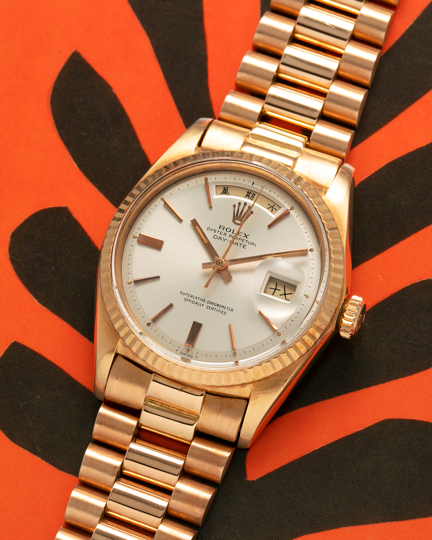 Brand: Rolex
Year: 1968
Model: Day-Date, ‘Doorstop’ Dial
Reference Number: 1803
Serial: 178XXXX
Material: 18-carat Rose Gold
Movement: Rolex Cal. 1556, Self-Winding
Case Dimensions: 36mm x 12.5mm (Lug-to-Lug 43mm)
Lug Width: 20mm
Bracelet: Rolex Presidential Bracelet in 18-carat Rose Gold with Signed Folding Clasp