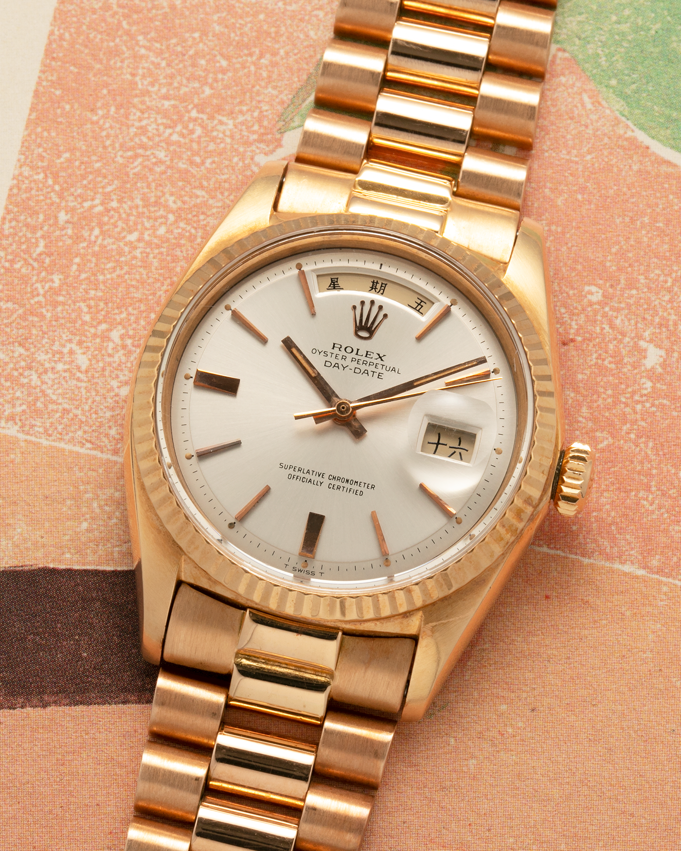 Brand: Rolex
Year: 1968
Model: Day-Date, ‘Doorstop’ Dial
Reference Number: 1803
Serial: 178XXXX
Material: 18-carat Rose Gold
Movement: Rolex Cal. 1556, Self-Winding
Case Dimensions: 36mm x 12.5mm (Lug-to-Lug 43mm)
Lug Width: 20mm
Bracelet: Rolex Presidential Bracelet in 18-carat Rose Gold with Signed Folding Clasp