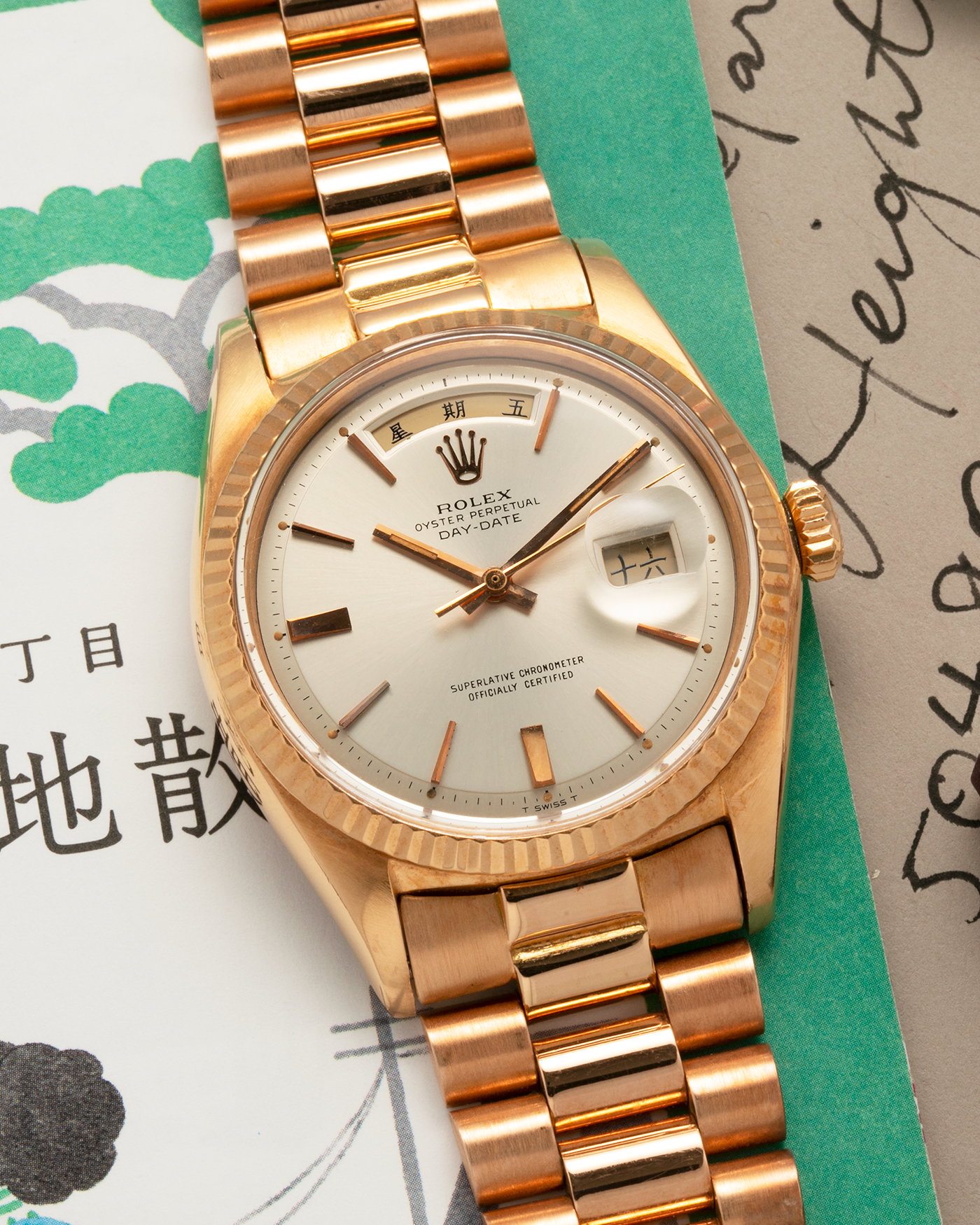 Brand: Rolex
Year: 1968
Model: Day-Date, ‘Doorstop’ Dial
Reference Number: 1803
Serial: 178XXXX
Material: 18-carat Rose Gold
Movement: Rolex Cal. 1556, Self-Winding
Case Dimensions: 36mm x 12.5mm (Lug-to-Lug 43mm)
Lug Width: 20mm
Bracelet: Rolex Presidential Bracelet in 18-carat Rose Gold with Signed Folding Clasp