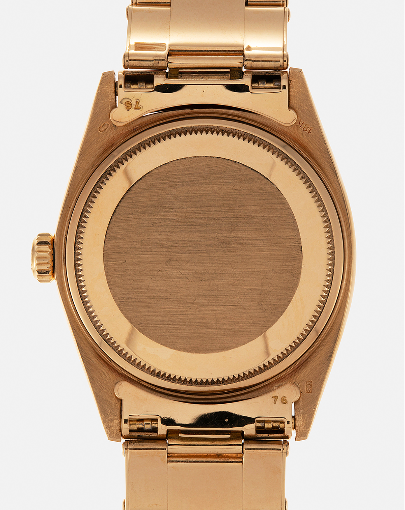 Brand: Rolex
Year: 1971
Model: Day-Date ‘Wide Boy'
Reference Number: 1803
Serial Number: 285XXXX
Material: 18-carat Yellow Gold
Movement: Rolex Cal. 1556, Self-Winding
Case Dimensions: 36mm x 12.5mm (Lug-to-Lug 43mm)
Lug Width: 20mm
Bracelet: Rolex Gay Frères Oyster Rivet Bracelet in 18-carat Yellow Gold with ‘76’ Endlinks and Signed Clasp